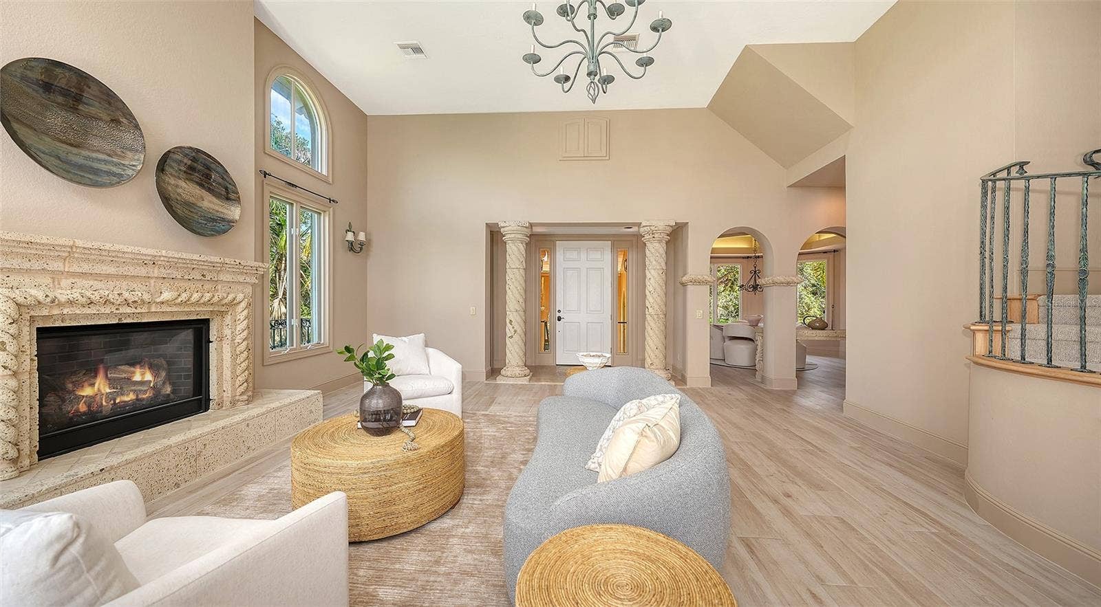 168 COASTAL HAMMOCK COURT, Osprey, FL 34229 A fireplace, custom millwork and graceful architectural elements bring warmth and character to the main living area.