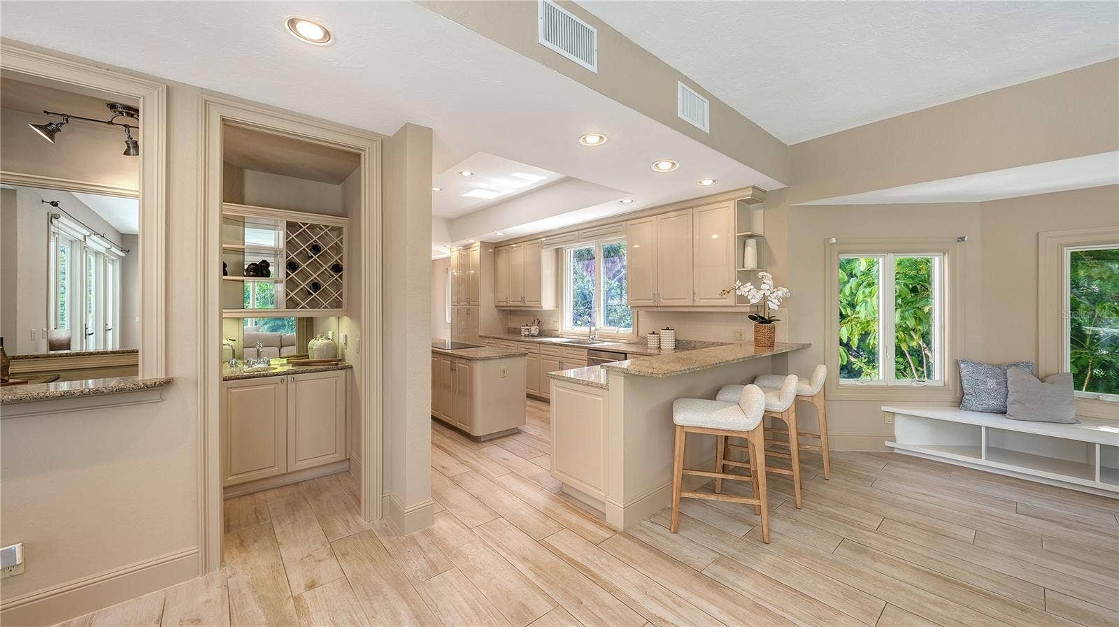 168 COASTAL HAMMOCK COURT, Osprey, FL 34229 The kitchen opens naturally to the surrounding living spaces, creating an easy flow for everyday living and entertaining.