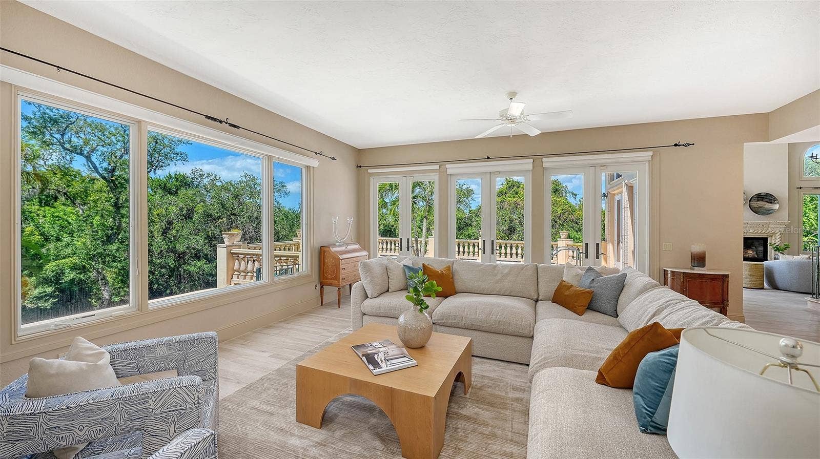 168 COASTAL HAMMOCK COURT, Osprey, FL 34229 French doors and oversized windows bring the beauty of the surrounding landscape into the home's main gathering areas.