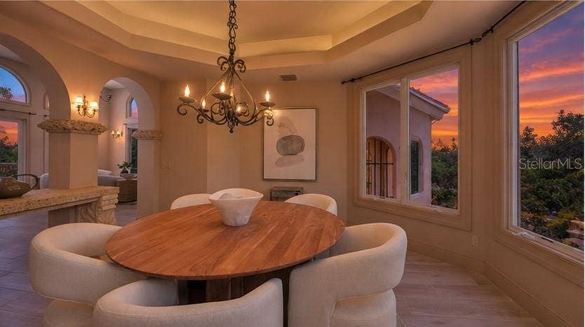 168 COASTAL HAMMOCK COURT, Osprey, FL 34229 Enjoy unforgettable Florida sunsets from the elegance and comfort of the formal dining room.