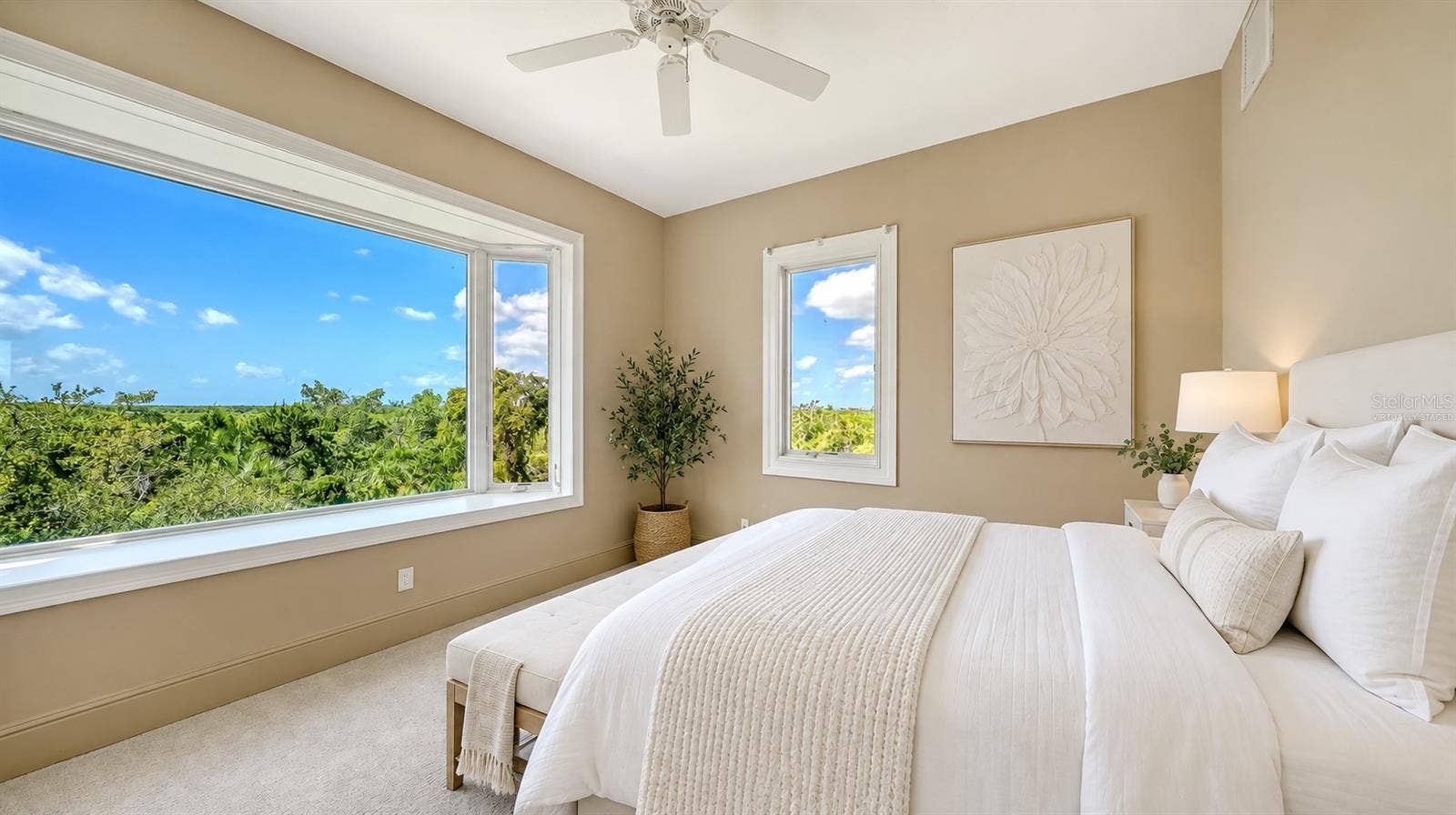 168 COASTAL HAMMOCK COURT, Osprey, FL 34229 Bedroom Two (Virtually Staged) is a bright and inviting secondary bedroom enjoys beautiful treetop views and abundant natural light.