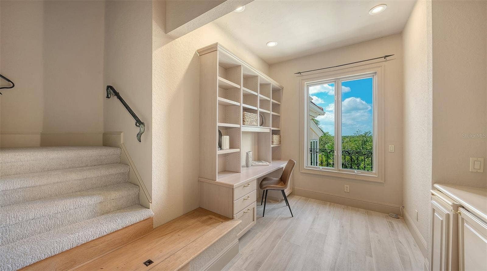 168 COASTAL HAMMOCK COURT, Osprey, FL 34229 Built in workspace and storage create an ideal setting for a home office, study or additional media area.