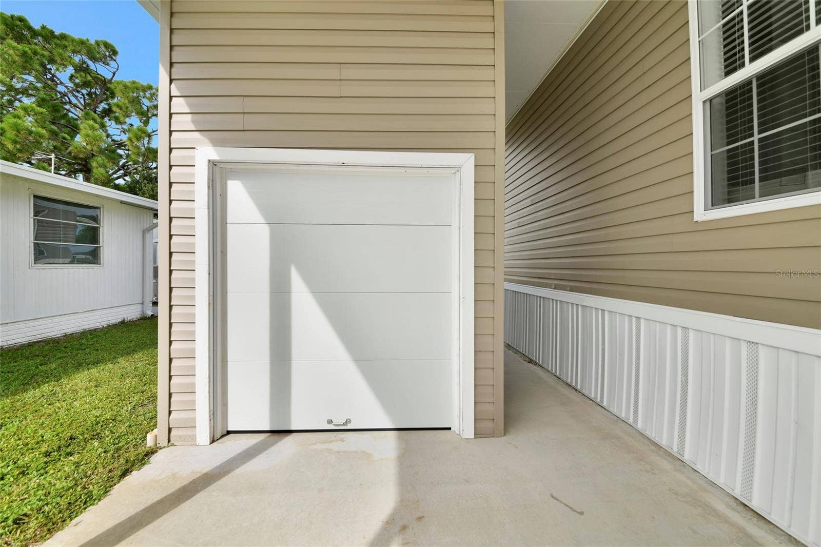 6843 HIKINA DRIVE, North Port, FL 34287 Shed w/garage door for easy golf cart access