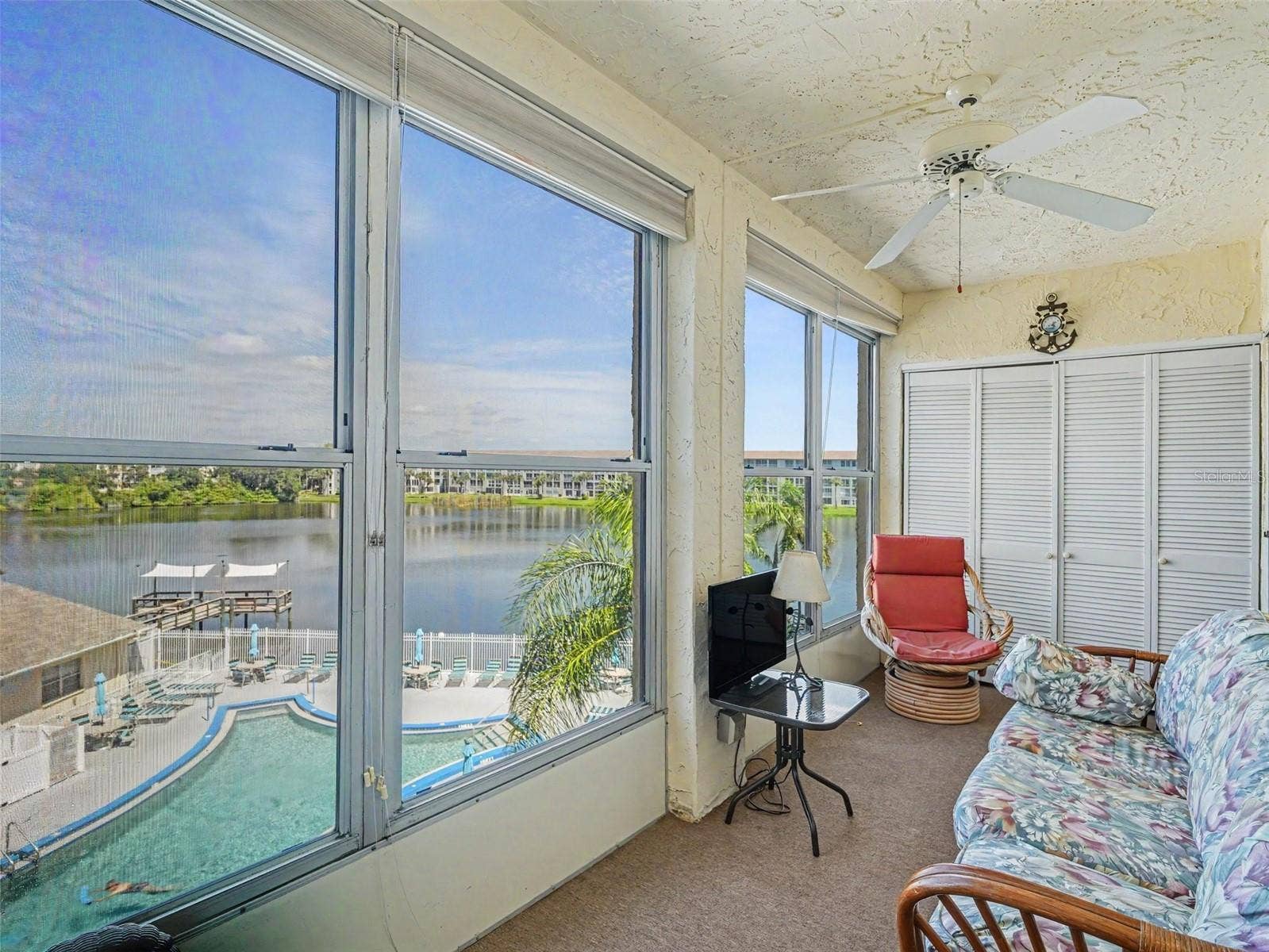 3785 LAKE BAYSHORE DRIVE, #H-405, Bradenton, FL 34205 Enclosed Lanai overlooking the lake and pool