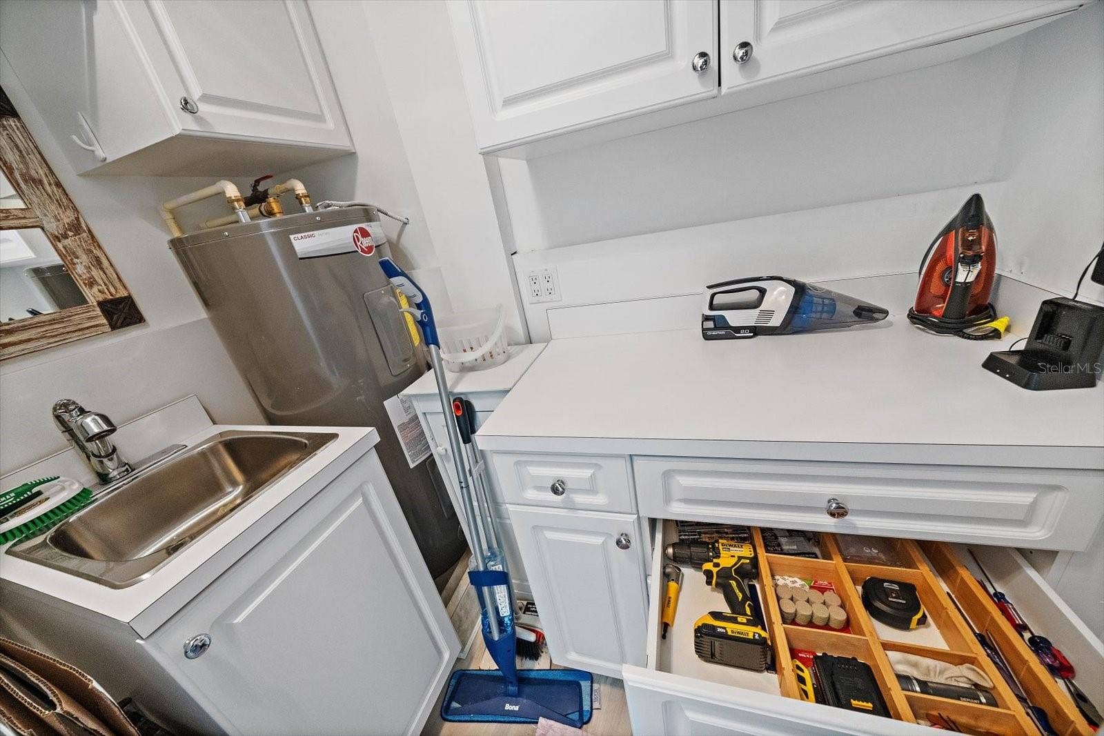 100 SANDS POINT ROAD, #219, Longboat Key, FL 34228 sink and extra storage in laundry