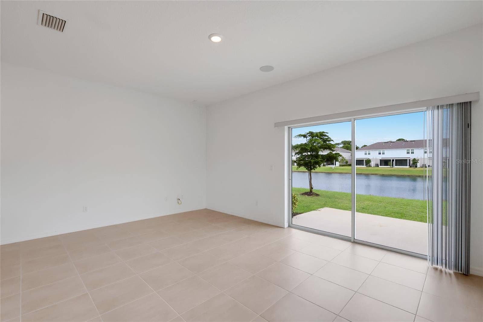 15150 GINETTI STREET, Nokomis, FL 34275 As an end unit, the family room (and corresponding upstairs master bedroom) extend nearly 3 feet more than interior units providing amazing living space! The lake views from the living room are spectacular!
