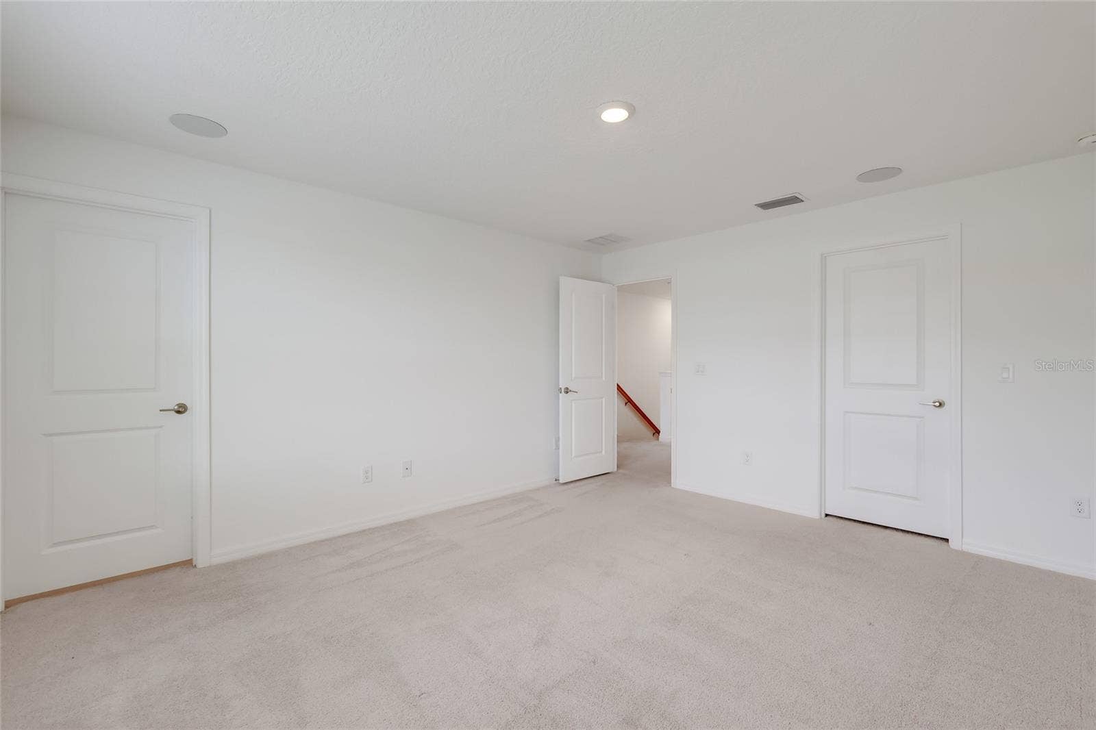 15150 GINETTI STREET, Nokomis, FL 34275 The master bedroom has its own master bathroom (shown with the door shut) and speakers in the ceiling as part of the full-house stereo system!