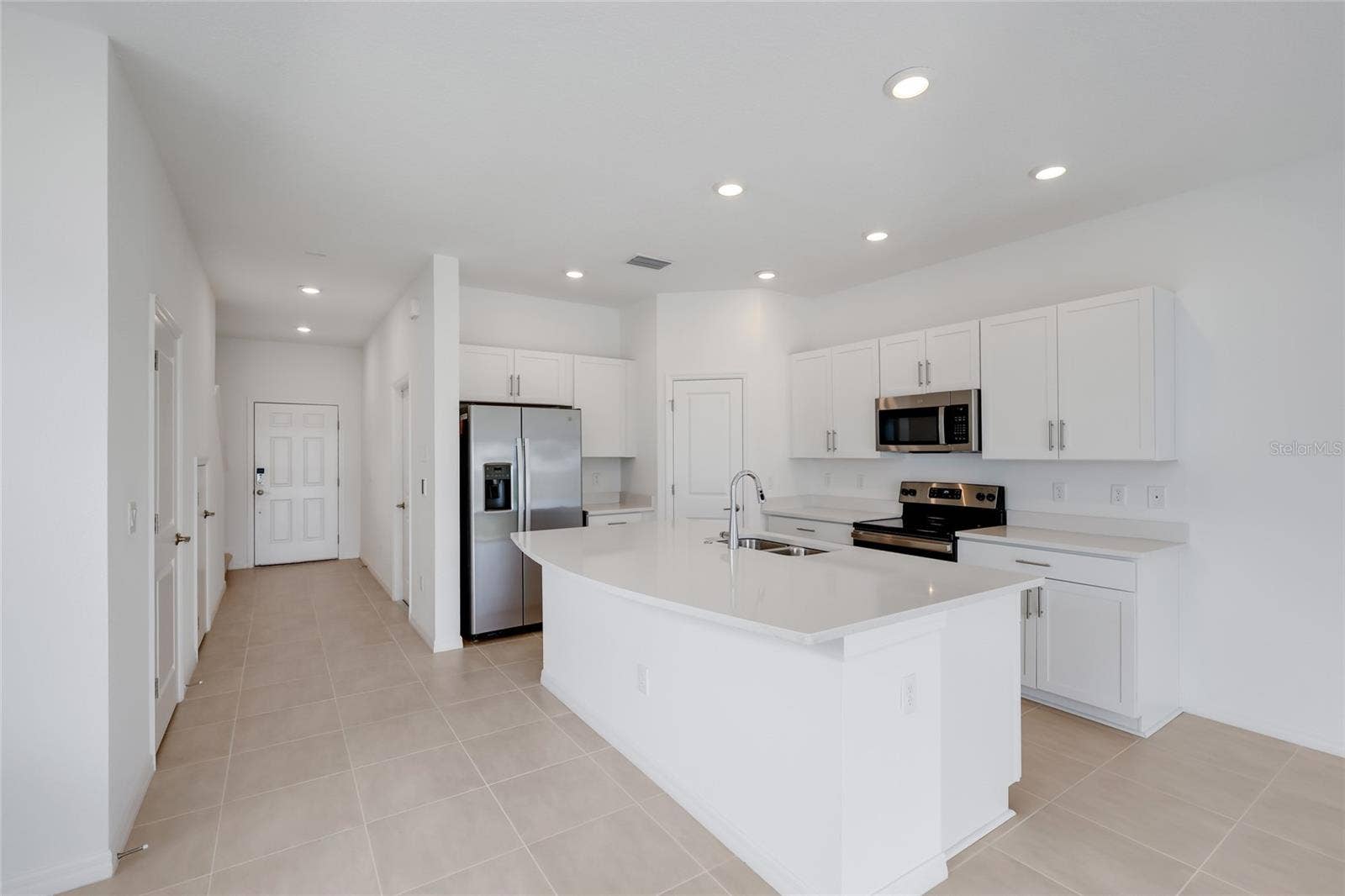 15150 GINETTI STREET, Nokomis, FL 34275 The large kitchen island provides a perfect area for entertaining as well as additional seating for family members for quick meals!