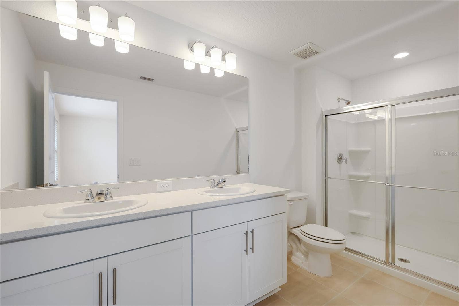 15150 GINETTI STREET, Nokomis, FL 34275 The master bathroom has a large double vanity providing ample space for two people to share to get their day started!