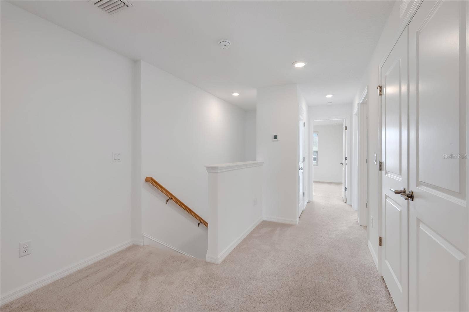 15150 GINETTI STREET, Nokomis, FL 34275 At the other end of the loft is the entrance to the other two bedrooms as well as the hall bathroom. Again, there is even more space for a small bench or another small work station area!