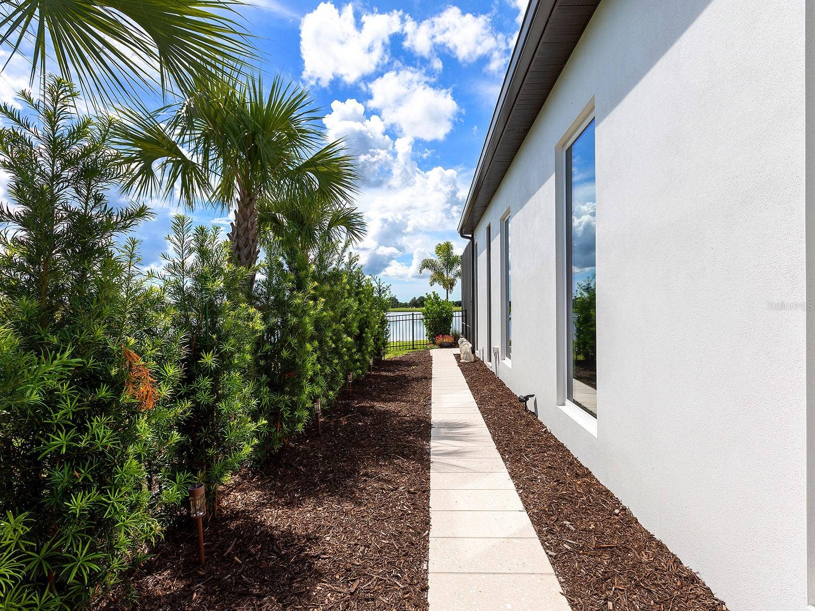 1320 IVORY TUSK CIRCLE, Sarasota, FL 34240 Private walkway from primary suite to the lanai