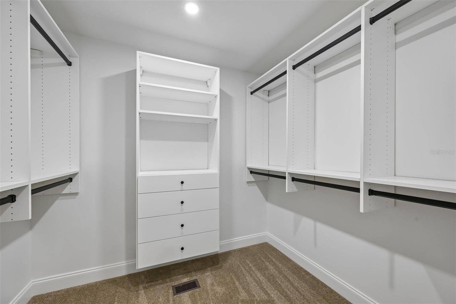 5060 18TH AVENUE W, Bradenton, FL 34209 2nd Large walking in closet with California Closet system in the primary suite.