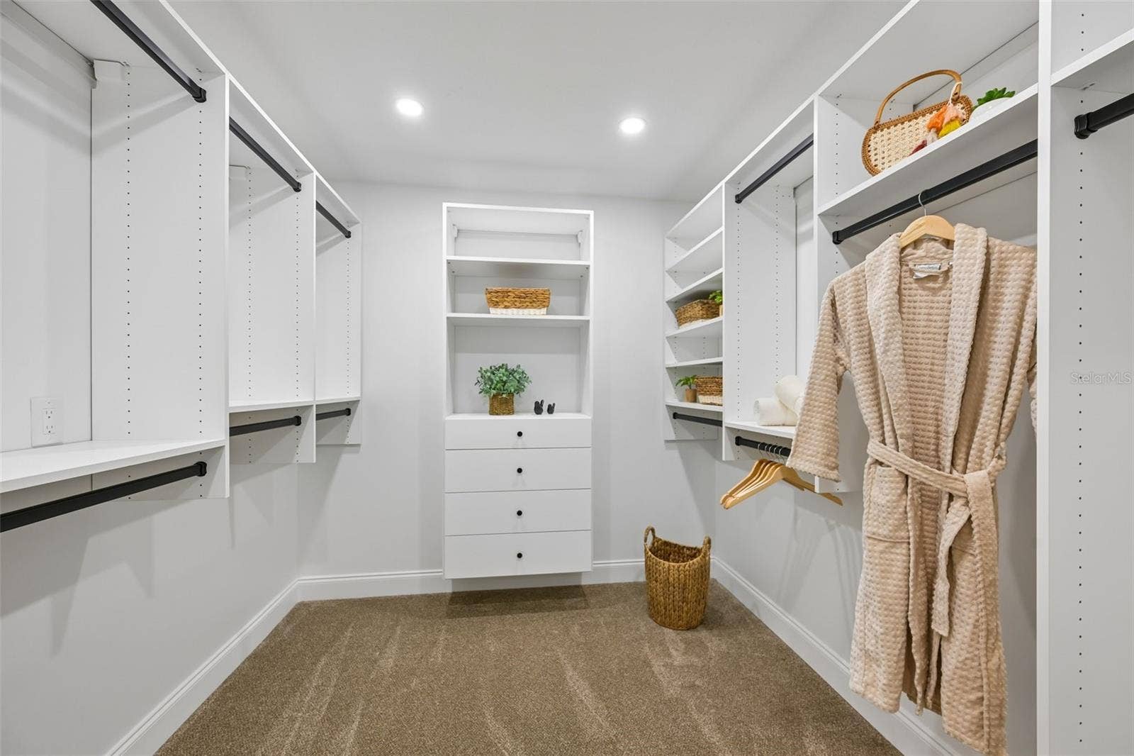 5060 18TH AVENUE W, Bradenton, FL 34209 1st walk-in closet with California Closet system in the primary suite