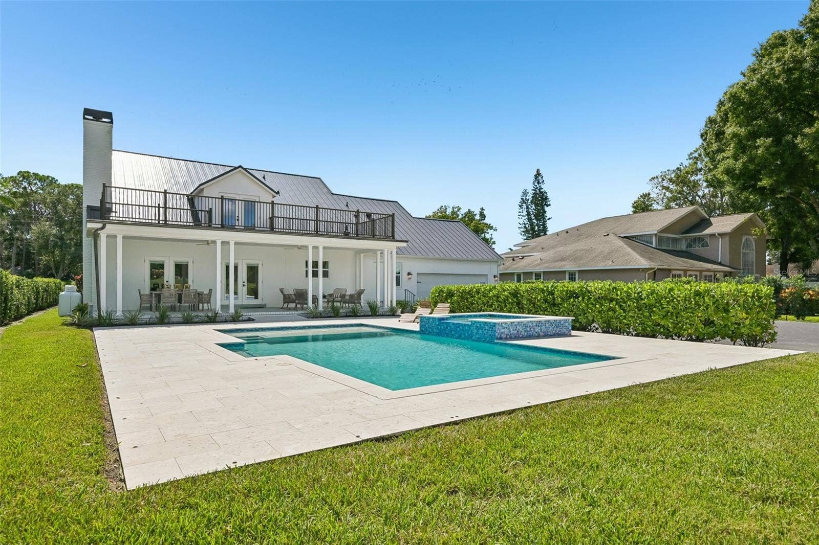 5060 18TH AVENUE W, Bradenton, FL 34209 This home features a large, heated saltwater pool and spa.