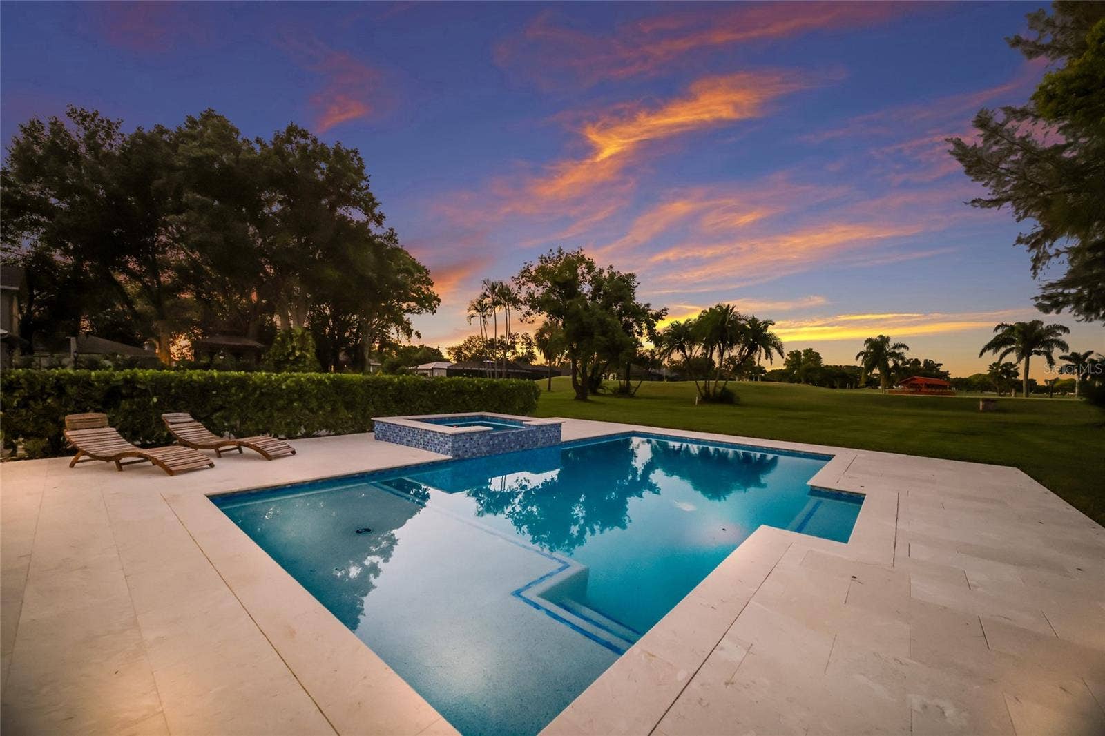 5060 18TH AVENUE W, Bradenton, FL 34209 Spacious pool deck with large custom salt water pool and spa.