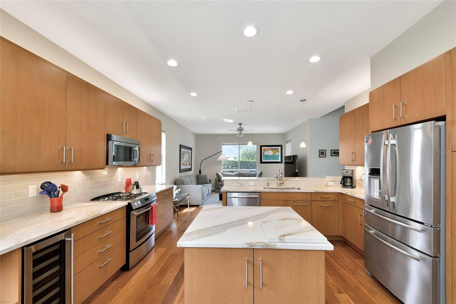 6256 DONNINGTON COURT, Sarasota, FL 34238 Island kitchen, quartzite counters, wine refrigerator, & Jen-Aire stainless appliances.