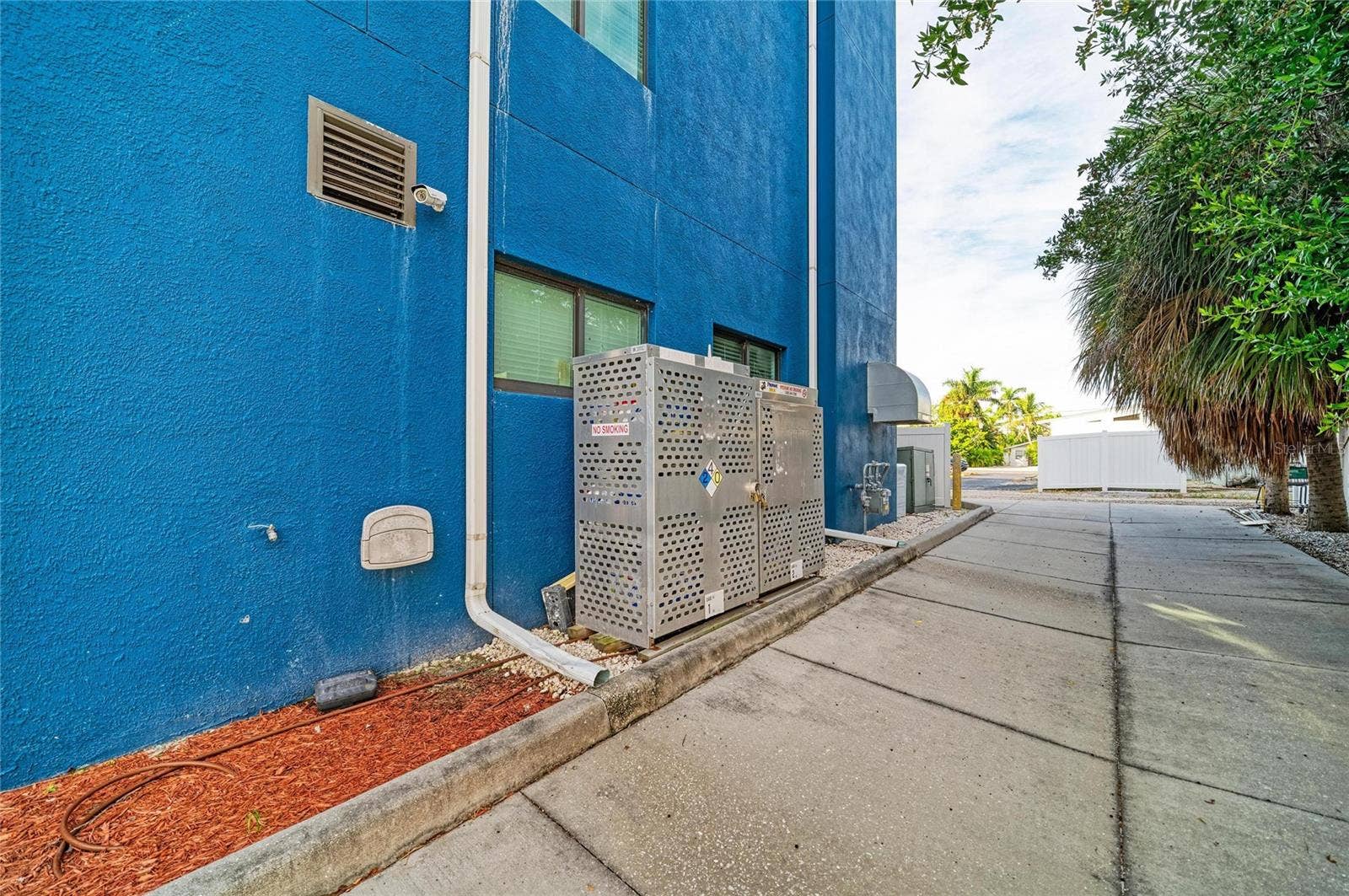 3004 AVENUE C, Holmes Beach, FL 34217 North side of building and through alley