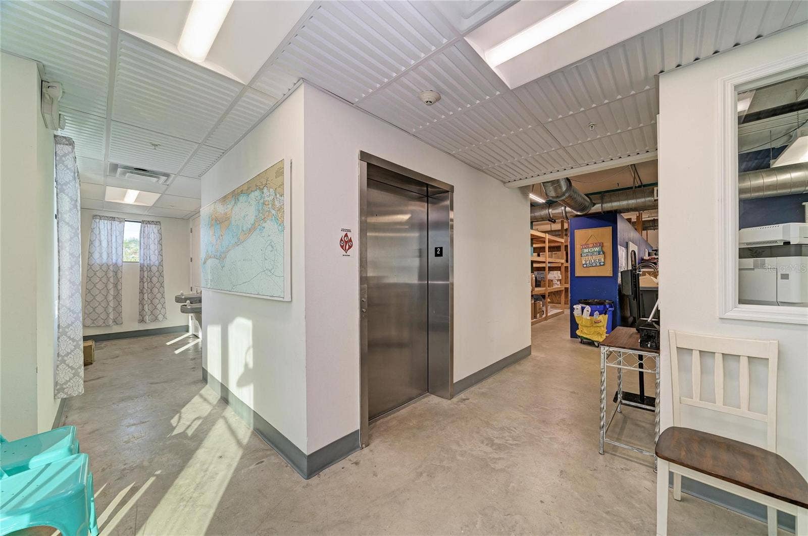 3004 AVENUE C, Holmes Beach, FL 34217 Lobby with bathrooms, egress and elevator