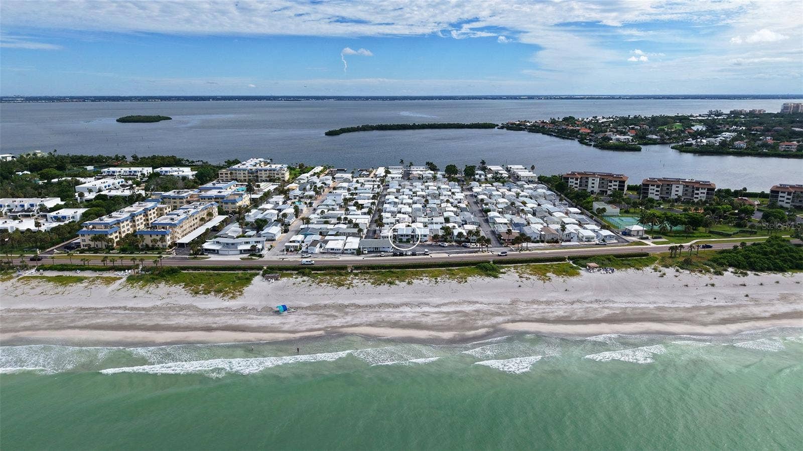 Front row with Gulf across street/deeded beach access