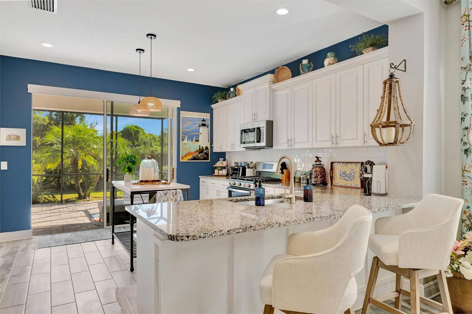 11115 SAND PINE LANE, Parrish, FL 34219 Breakfast bar overlooks backyard landscape