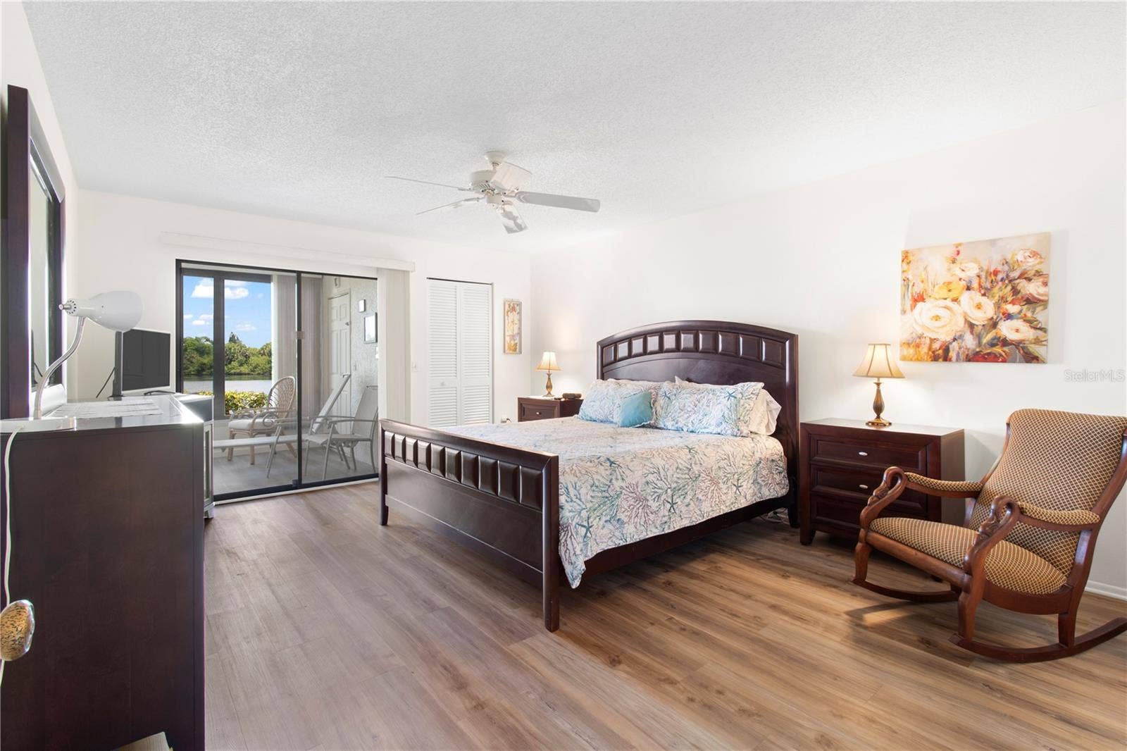 220 LAKEWOOD DRIVE, #220, Bradenton, FL 34210 Primary bedroom leading to lanai.