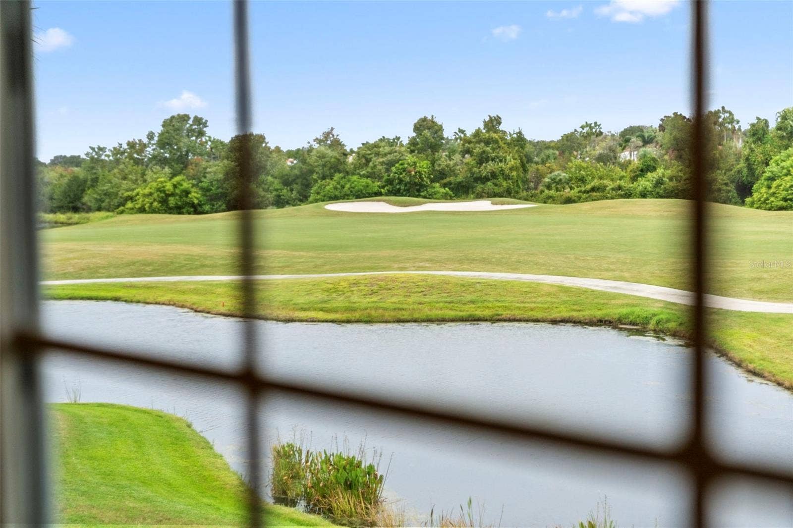 8432 MIRAMAR WAY, Lakewood Ranch, FL 34202 Peaceful water and sweeping fairway views make a beautiful start to the day.