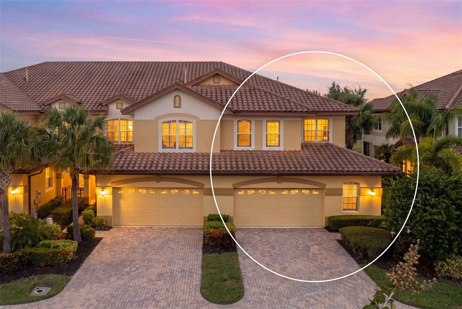 8432 MIRAMAR WAY, Lakewood Ranch, FL 34202 A warm welcome home, with a spacious driveway and oversized two-car plus golf cart garage.