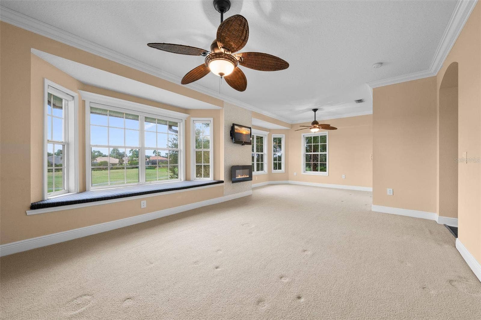 8432 MIRAMAR WAY, Lakewood Ranch, FL 34202 A spacious, light-filled retreat with expansive windows, a built-in window seat, and beautiful views.