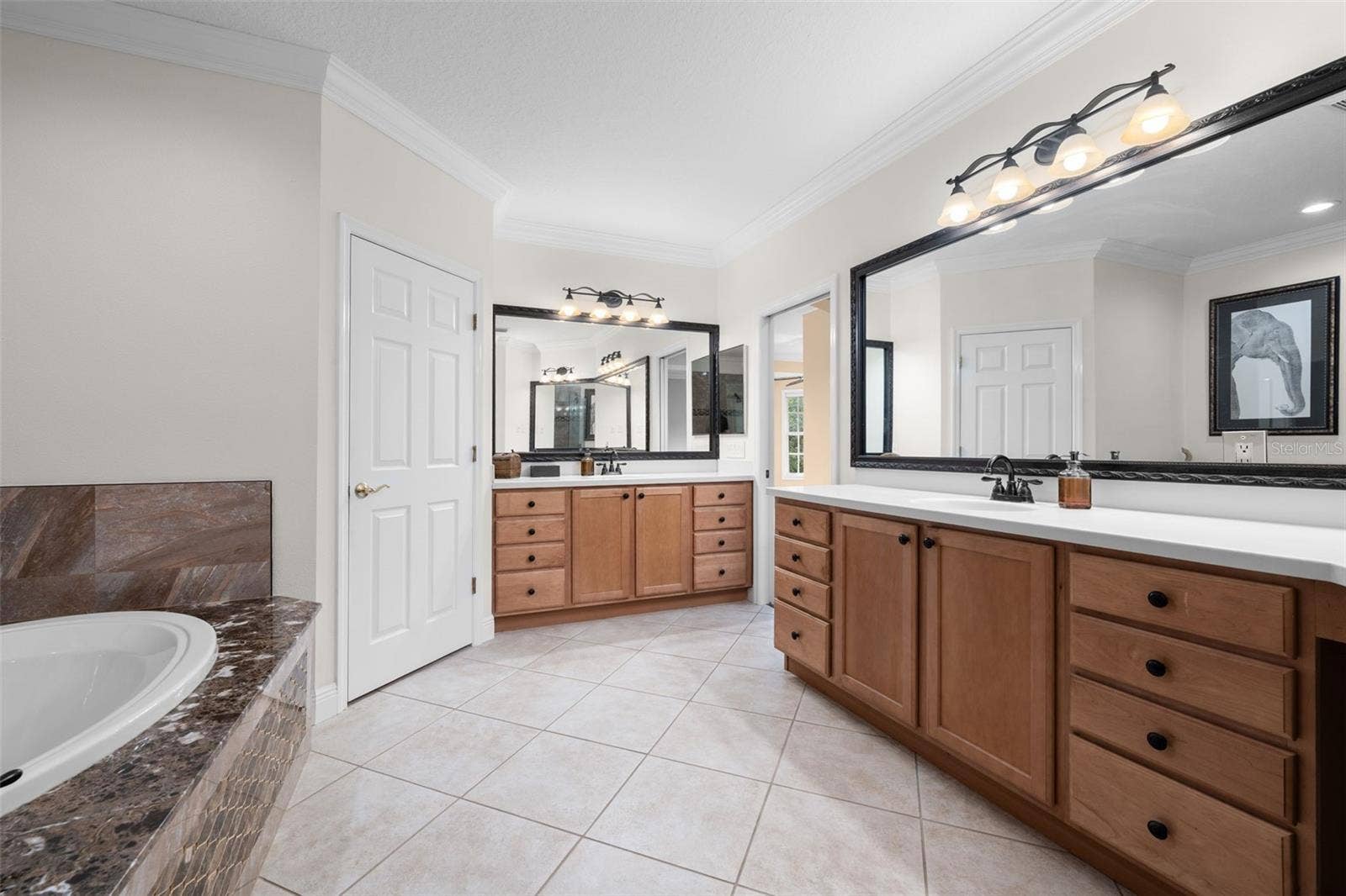 8432 MIRAMAR WAY, Lakewood Ranch, FL 34202 Separate vanities and abundant drawer space make sharing the primary bath easy.