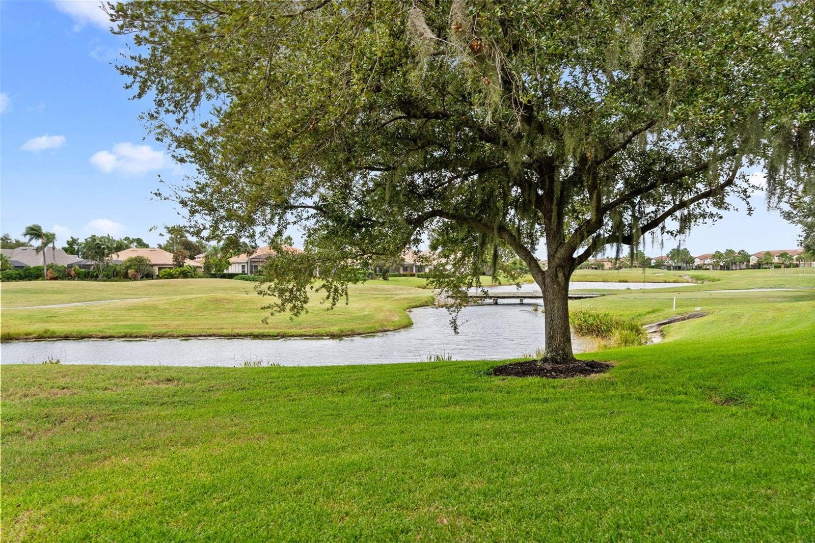 8432 MIRAMAR WAY, Lakewood Ranch, FL 34202 Peaceful lake views, open fairways, and mature trees make it easy to slow down and unwind.