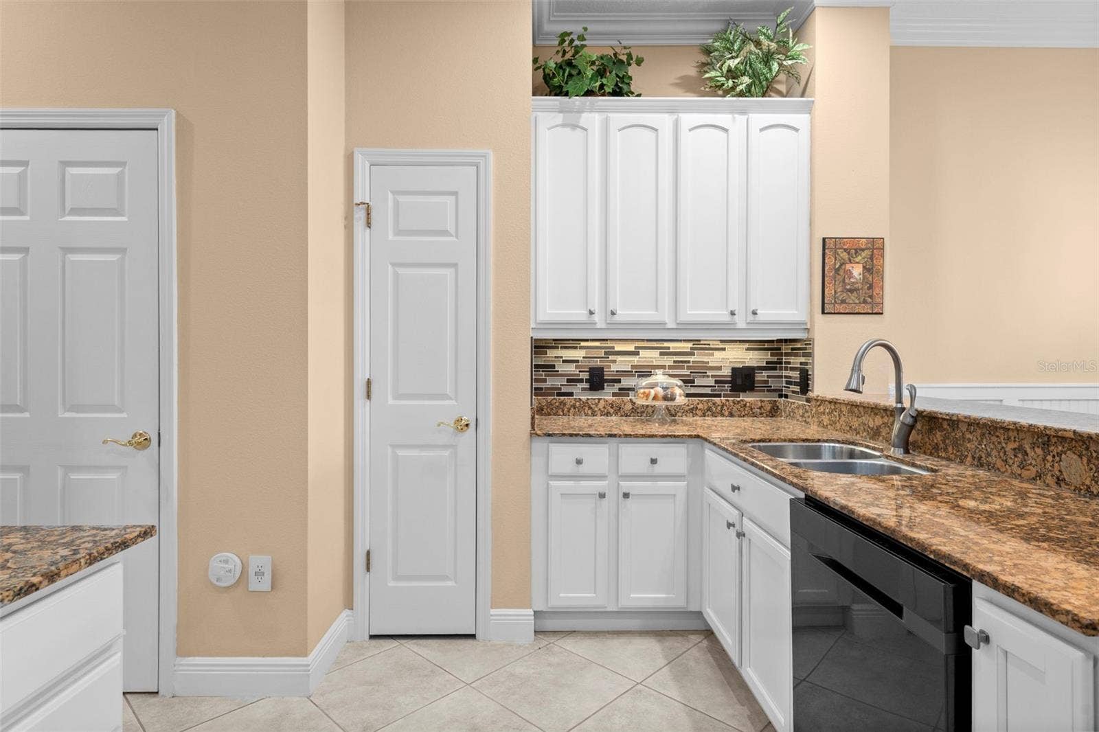 8432 MIRAMAR WAY, Lakewood Ranch, FL 34202 Plenty of cabinet space and a pantry keep kitchen essentials close at hand.