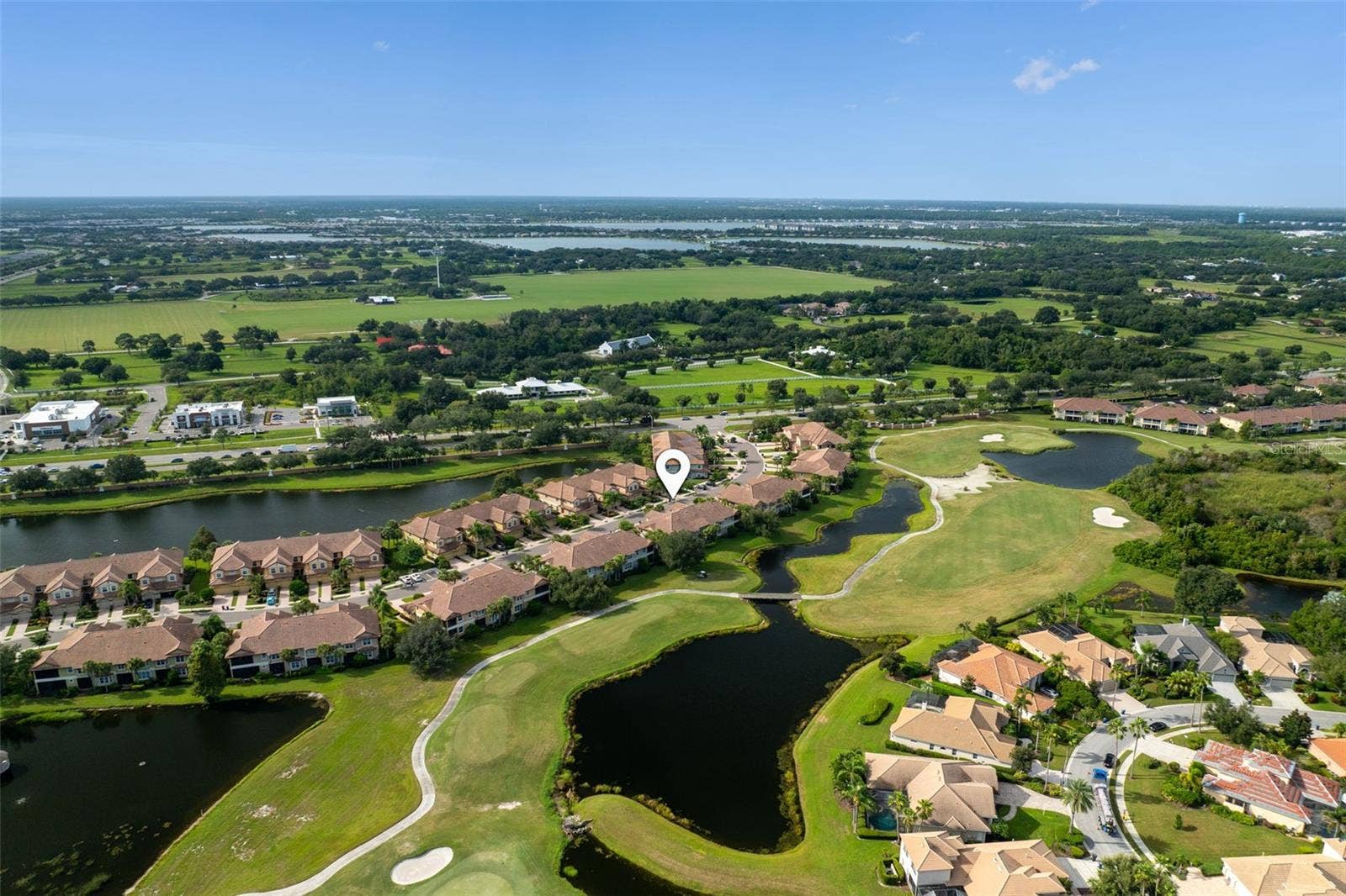 8432 MIRAMAR WAY, Lakewood Ranch, FL 34202 Set along Legacy Golf Course, this home enjoys sweeping fairway and lake viewsa beautiful backdrop for morning coffee, quiet evenings, and relaxed Florida living.