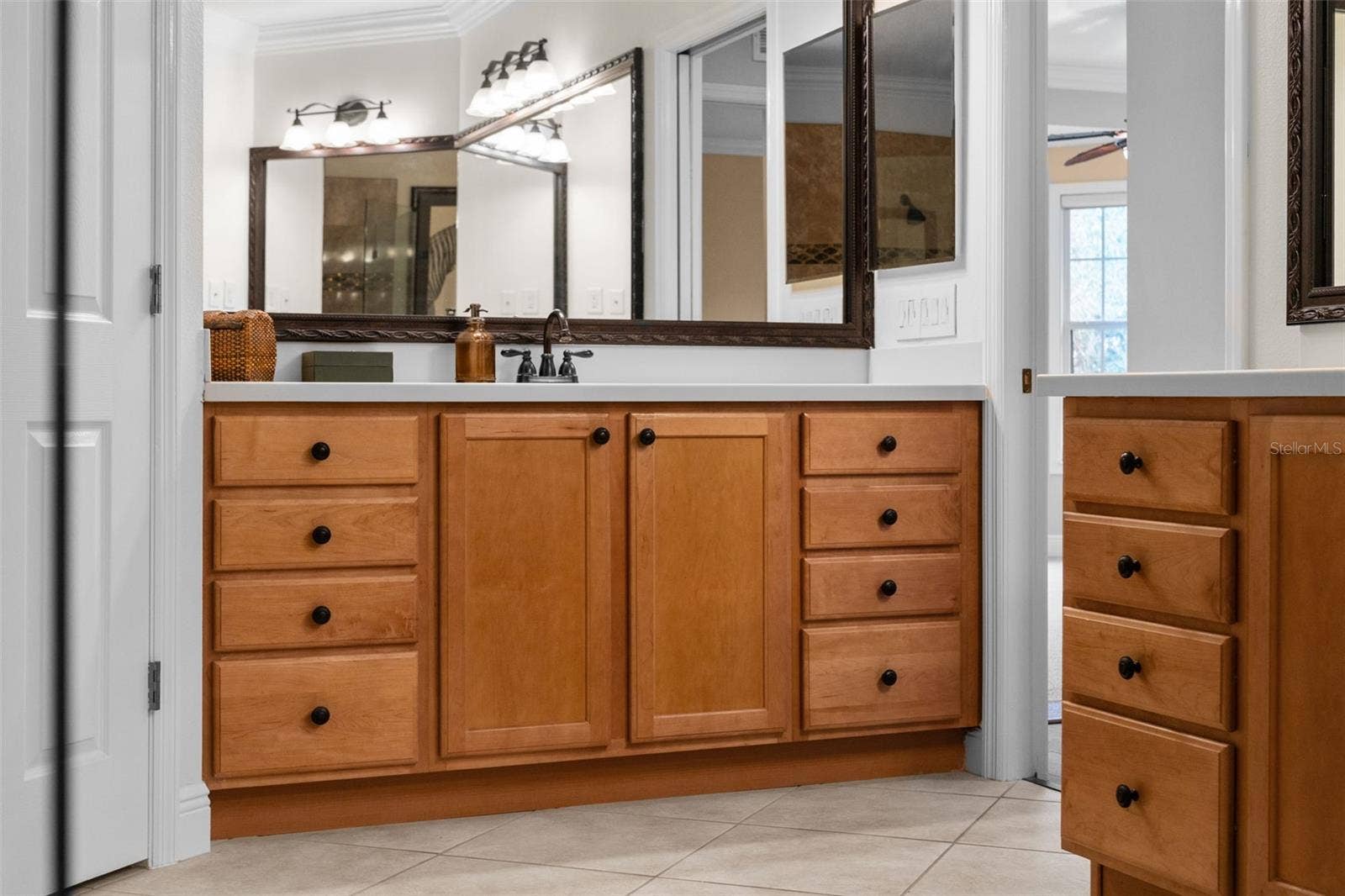 8432 MIRAMAR WAY, Lakewood Ranch, FL 34202 Separate vanities and abundant drawer space make sharing the primary bath easy.