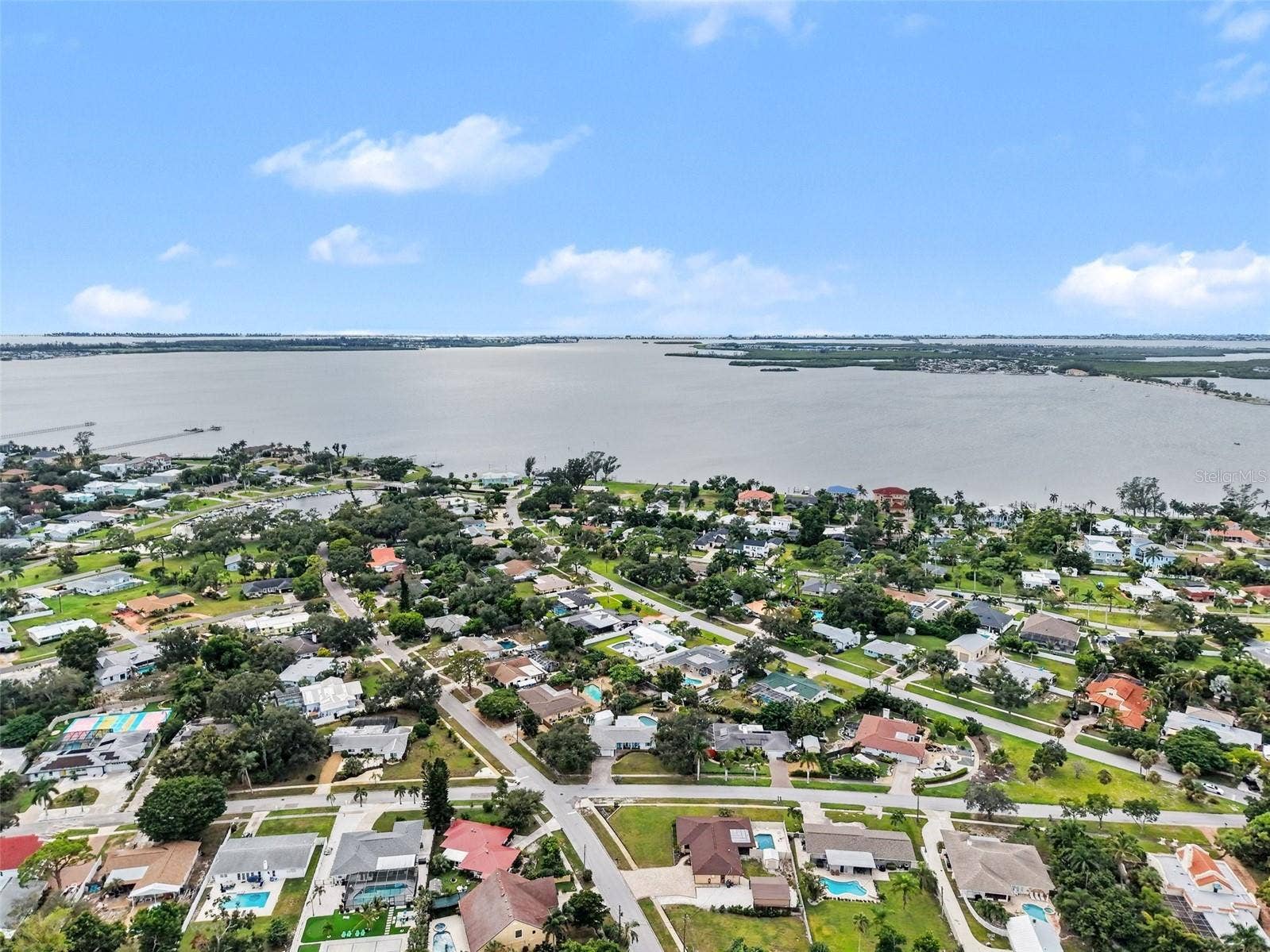 BOAT BASIN ON THE BAY AT THE END OF THE BLOCK.  BAY LIVING WITHOUT THE FLOOD ZONE, TAXES AND TRAFFIC