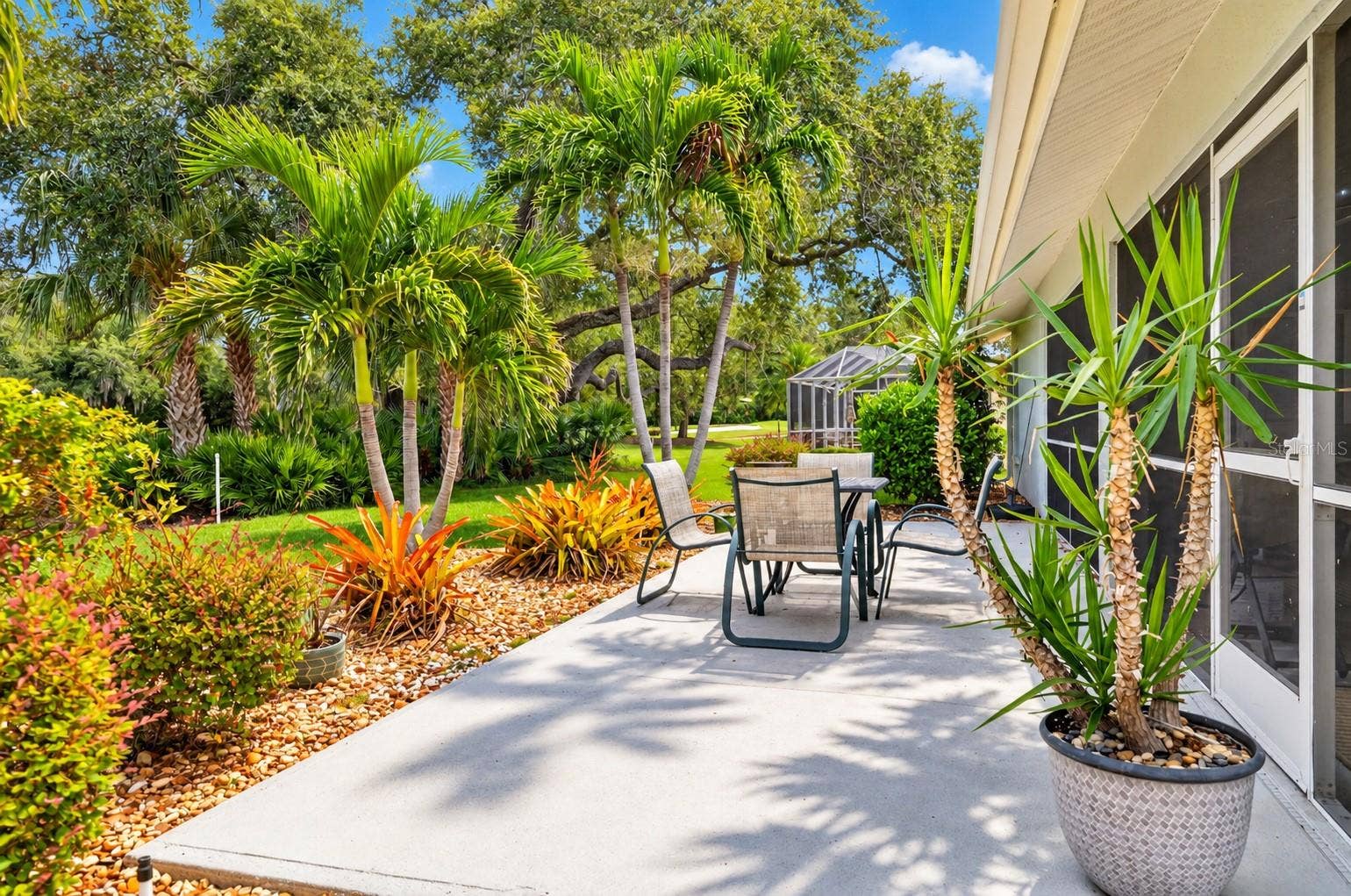 PATIO OUTSIDE OF THE SCREEN ENCLOSED LANAI
