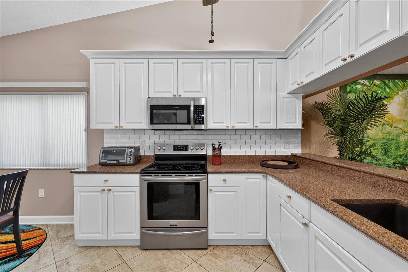 LARGE OPEN KITCHEN WITH AMPLE STORAGE