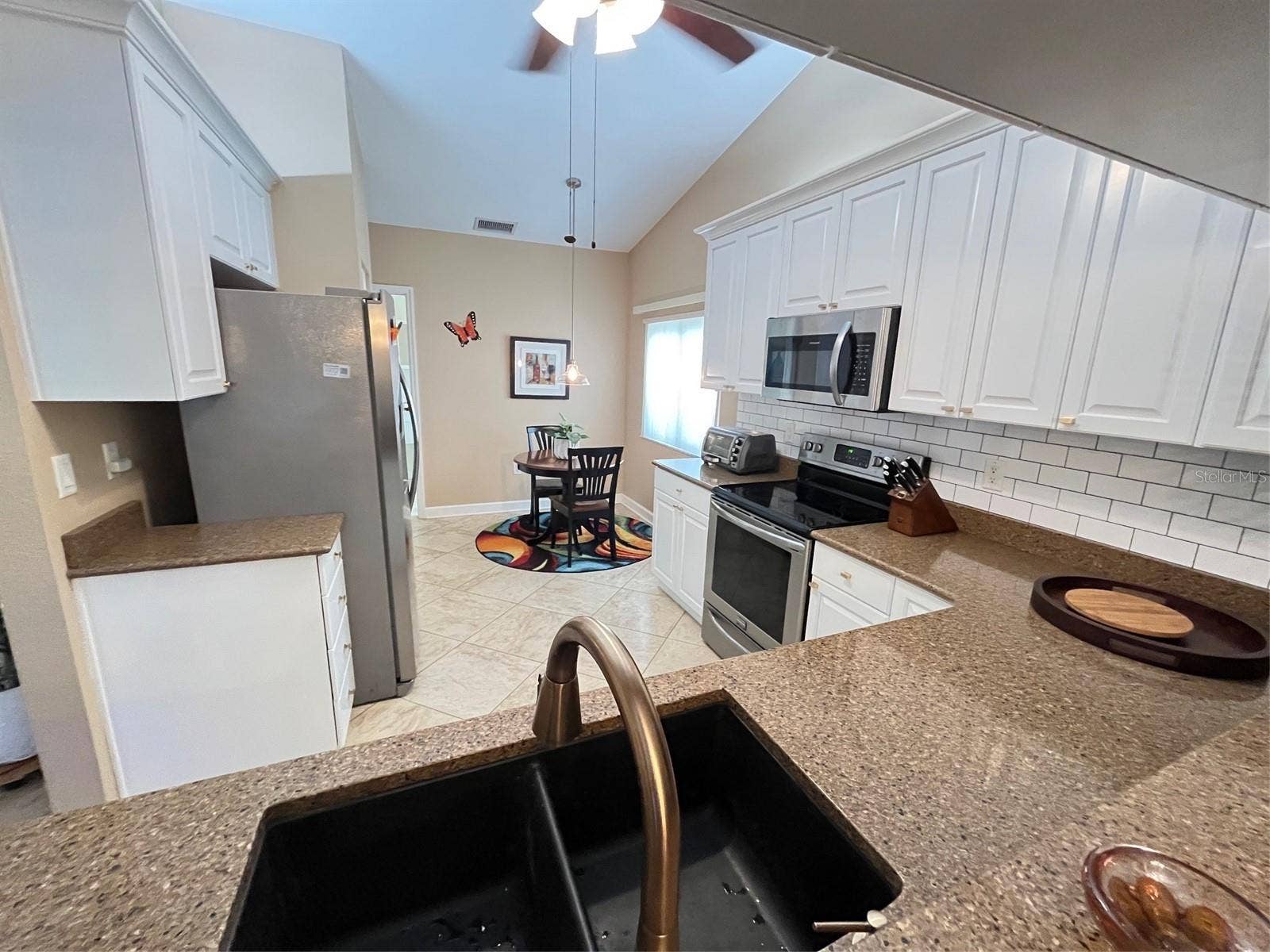 GRANITE COUNTERTOPS AND SUBWAY TILE BACKSPLASH