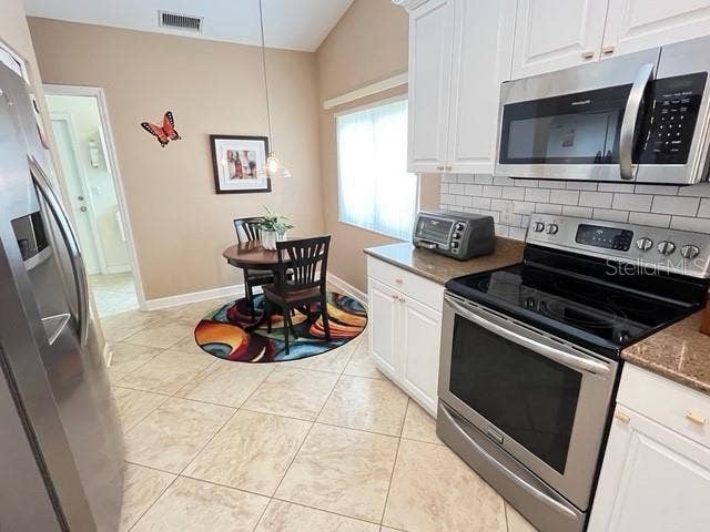 EAT-IN KITCHEN WITH AMPLE STORAGE AND CABINETRY