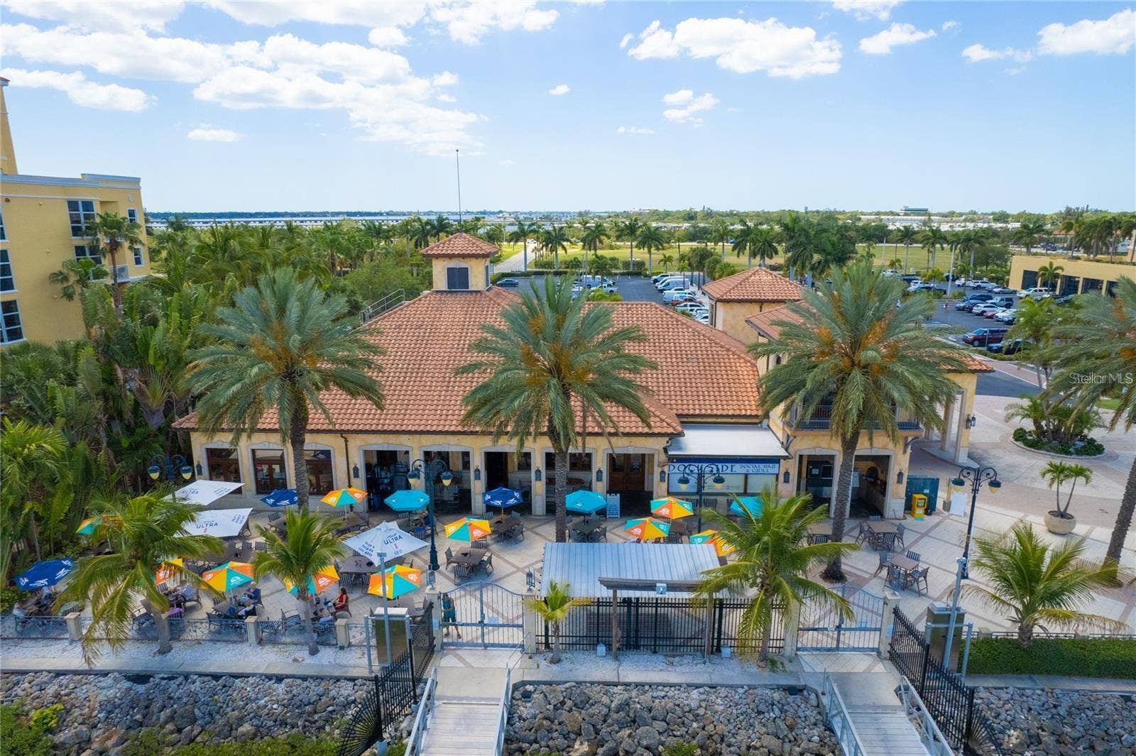 606 RIVIERA DUNES WAY, #405, Palmetto, FL 34221 Adjoining Full Service Restaurant - Aerial Patio View - overlooking the Riviera Dunes Marina