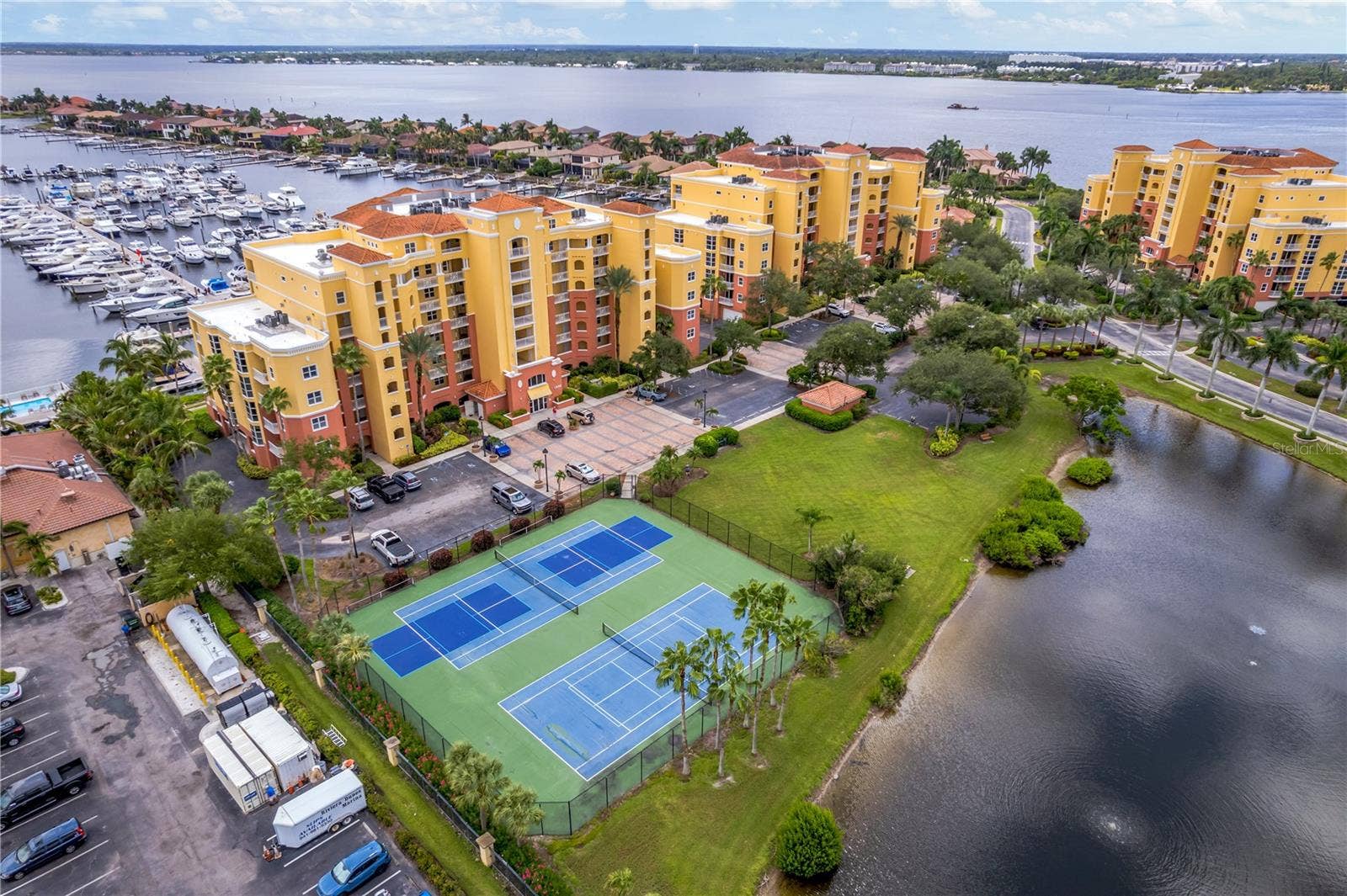 606 RIVIERA DUNES WAY, #405, Palmetto, FL 34221 Great access to the tennis and pickleball courts or a quick stroll next door to the Dockside Grill to meet friends for dinner or cocktails.