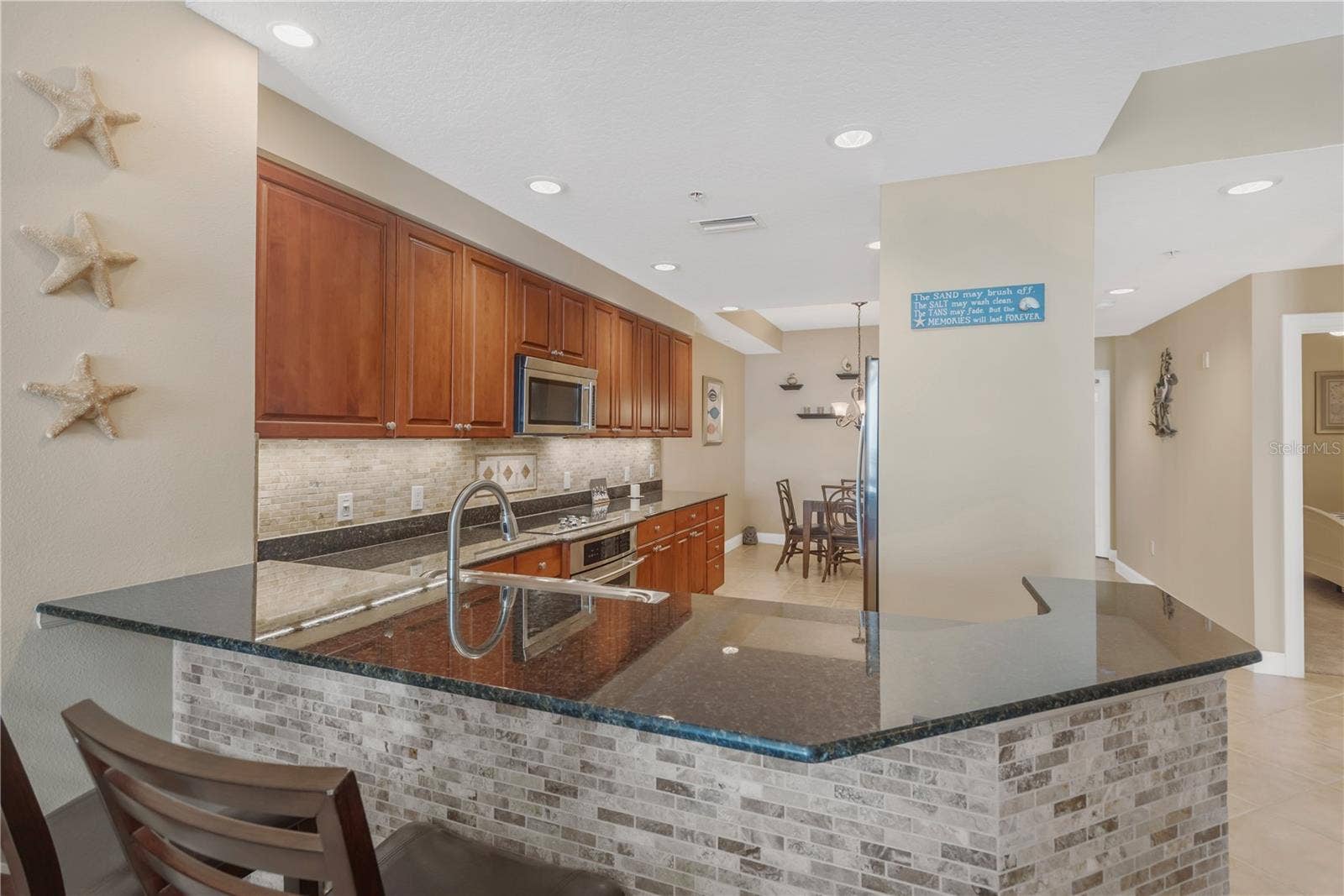606 RIVIERA DUNES WAY, #405, Palmetto, FL 34221 Open Breakfast Bar with seating...ideal for entertaining.