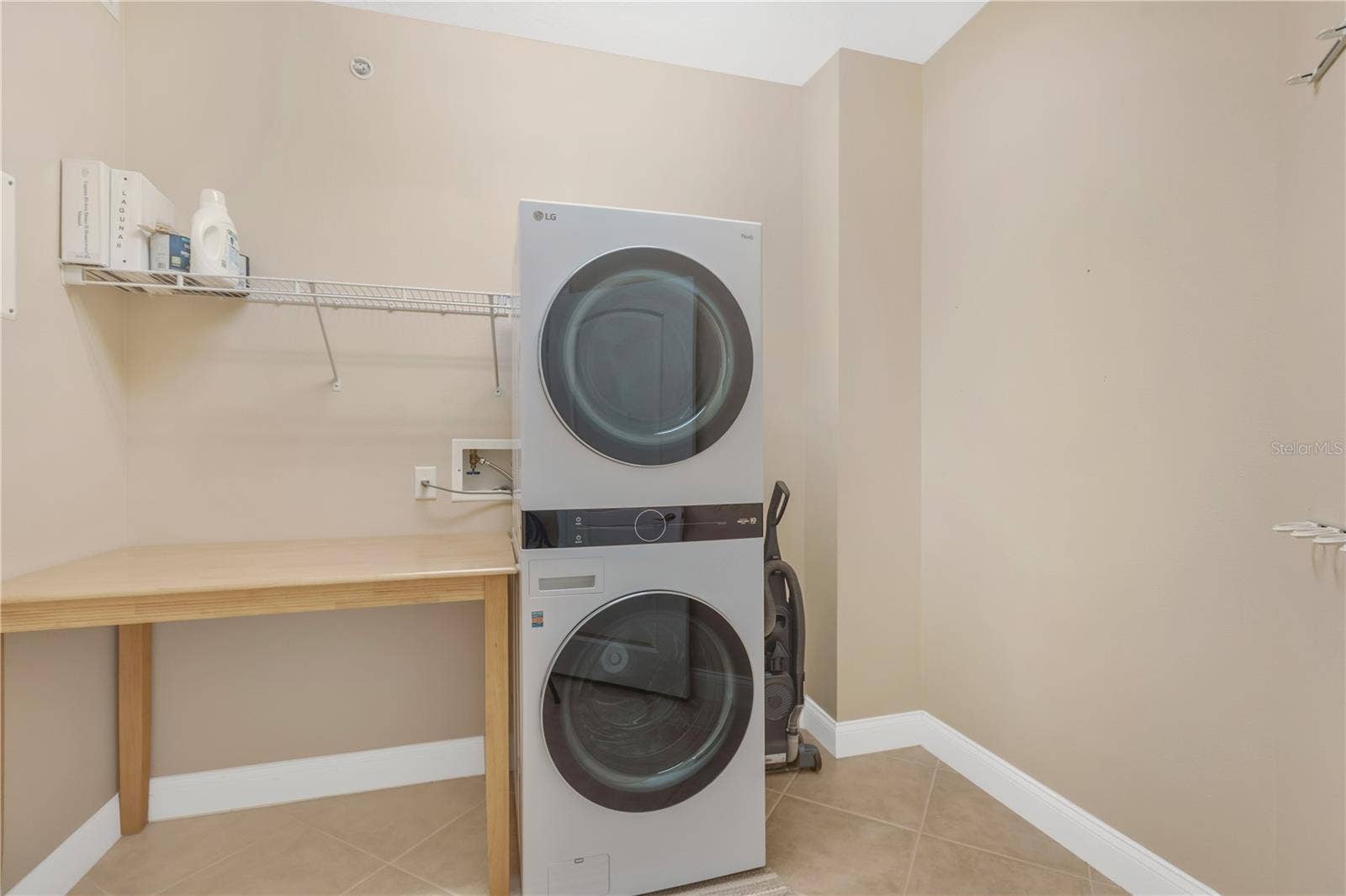 606 RIVIERA DUNES WAY, #405, Palmetto, FL 34221 Laundry Room with New (2025) Washer and Dryer Tower.