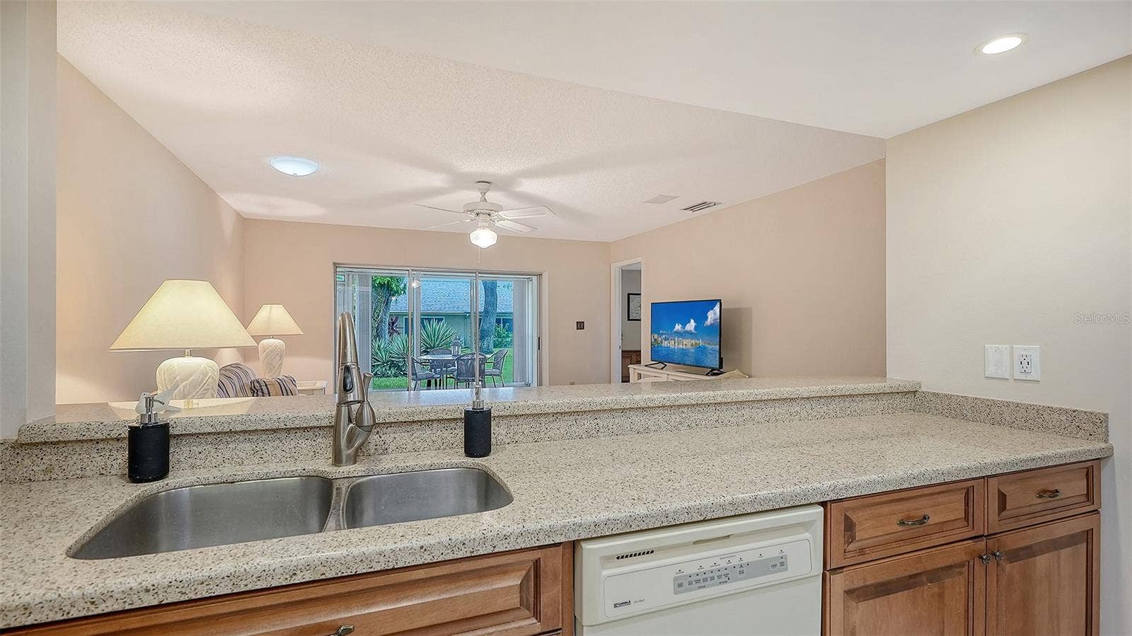 The view from the kitchen is tranquil and light.