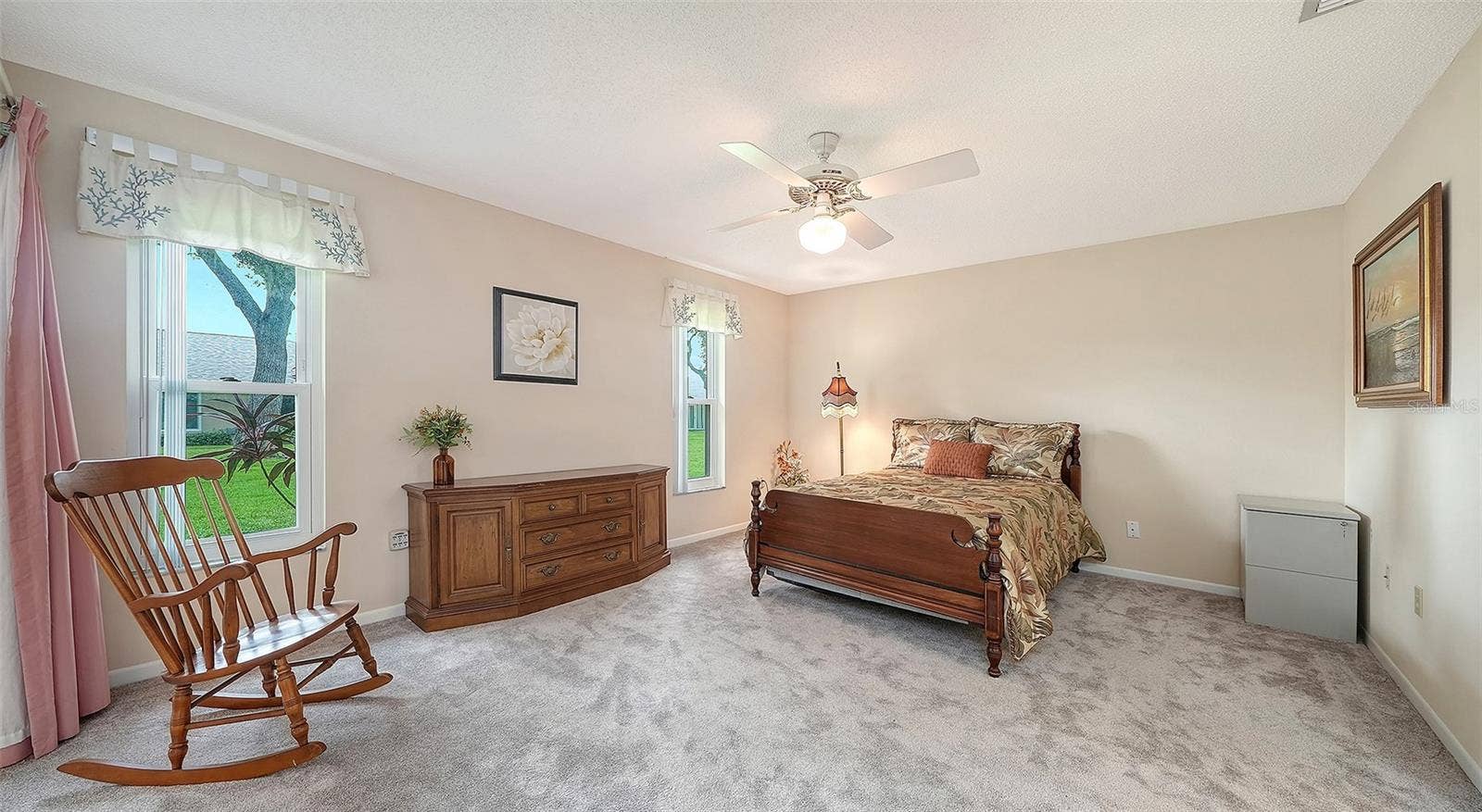 The primary bedroom is grand yet comfy.