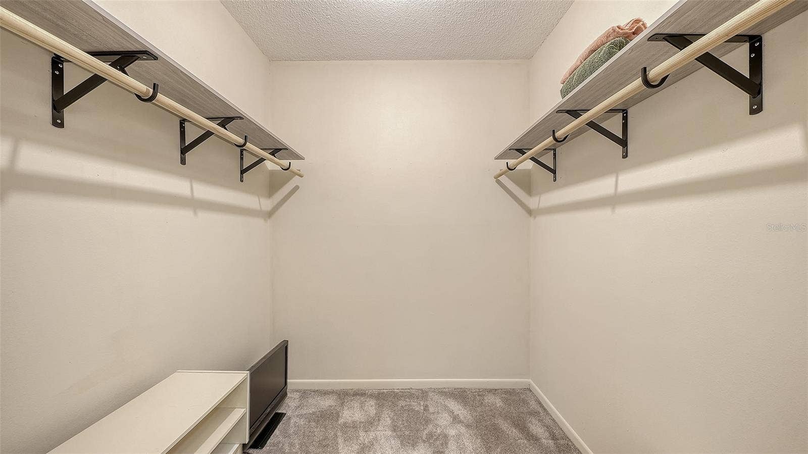 The primary bedroom has a walk-in closet. A rarity in a unit this size.