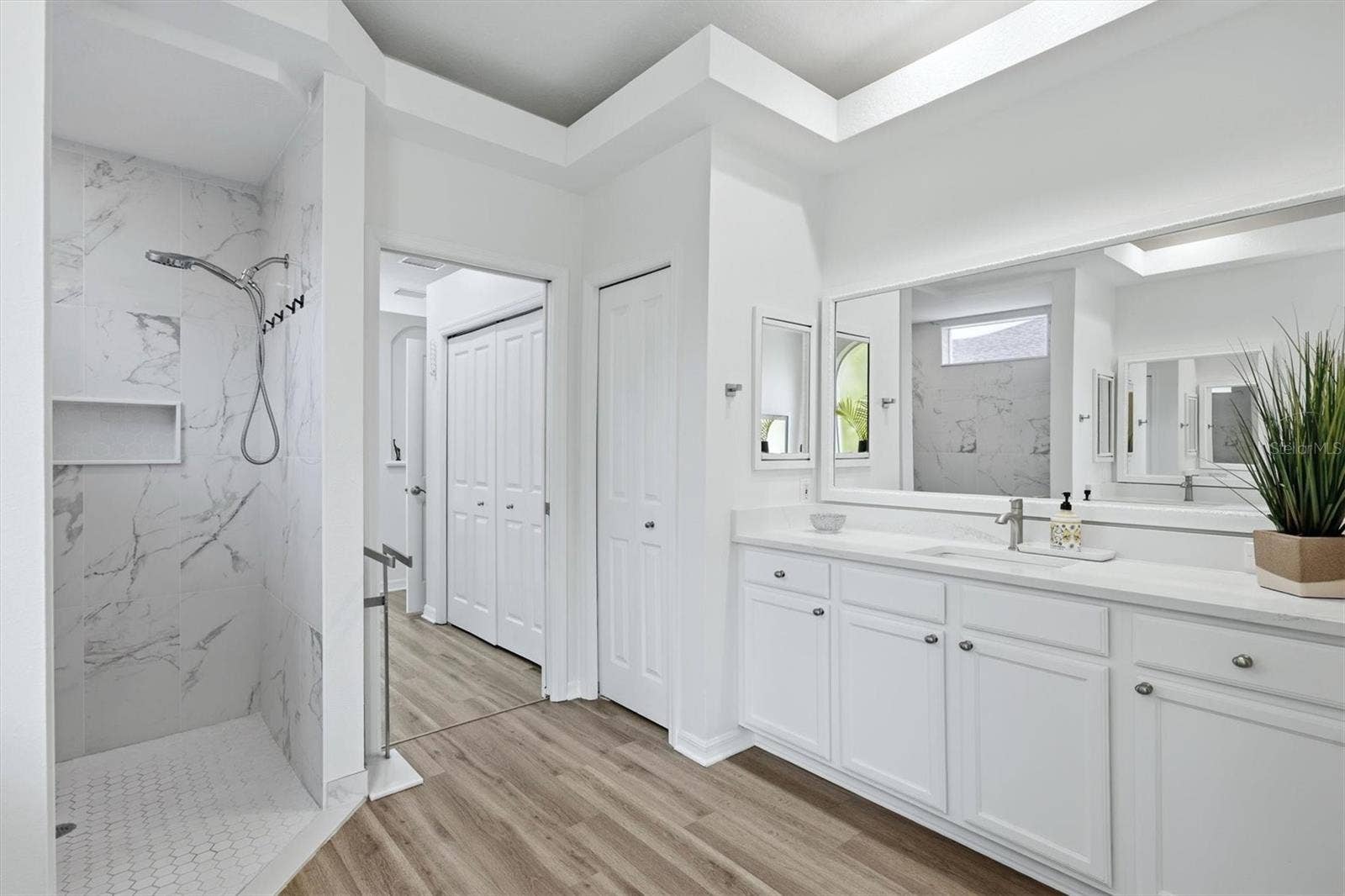 New updated primary bathroom wi5th new shower and countertops