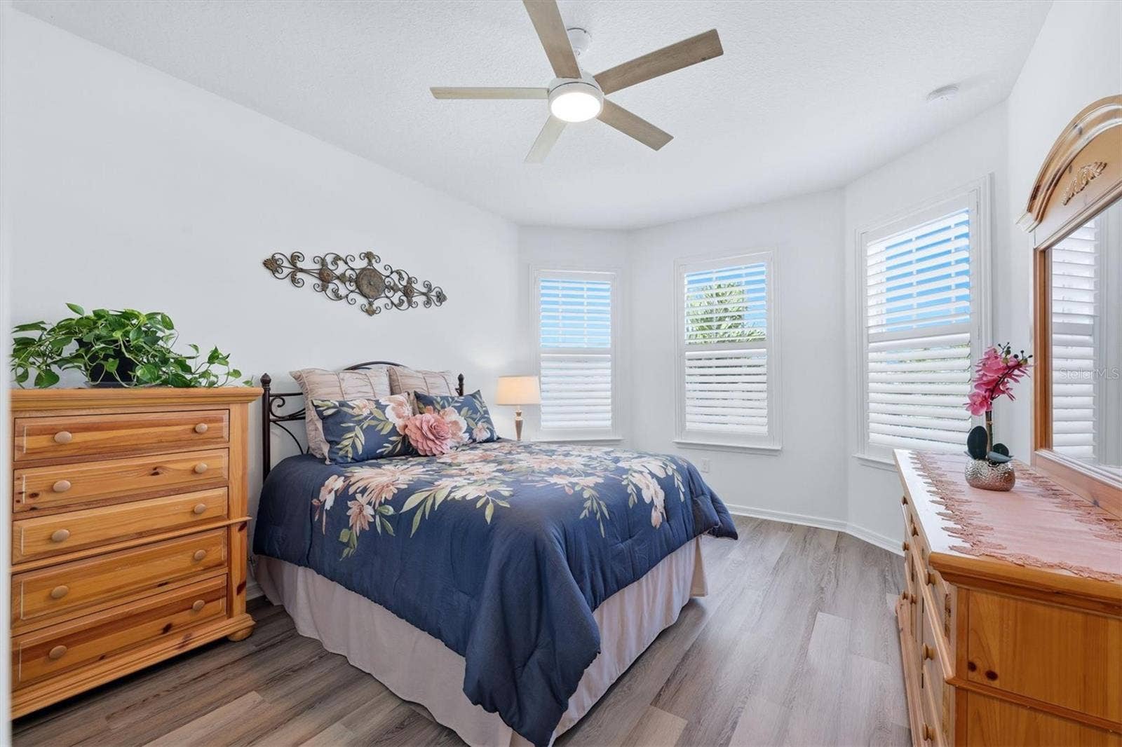 10635 WYNWARD WAY, Parrish, FL 34219 Second Bedroom with newer LPV flooring, ceiling fan and plantation shutters