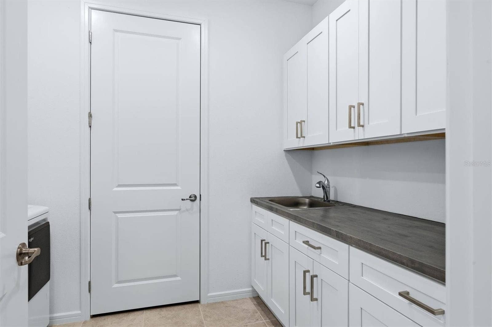 10635 WYNWARD WAY, Parrish, FL 34219 Huge laundry room with lots of workspace and custom cabinetry & countertop