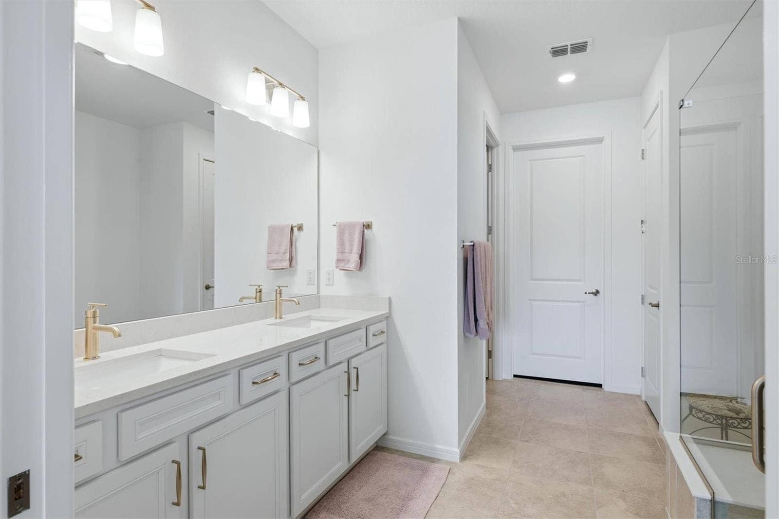 10635 WYNWARD WAY, Parrish, FL 34219 Primary Bath with double sinks, separate room for commode, walk in closet and linen closet.