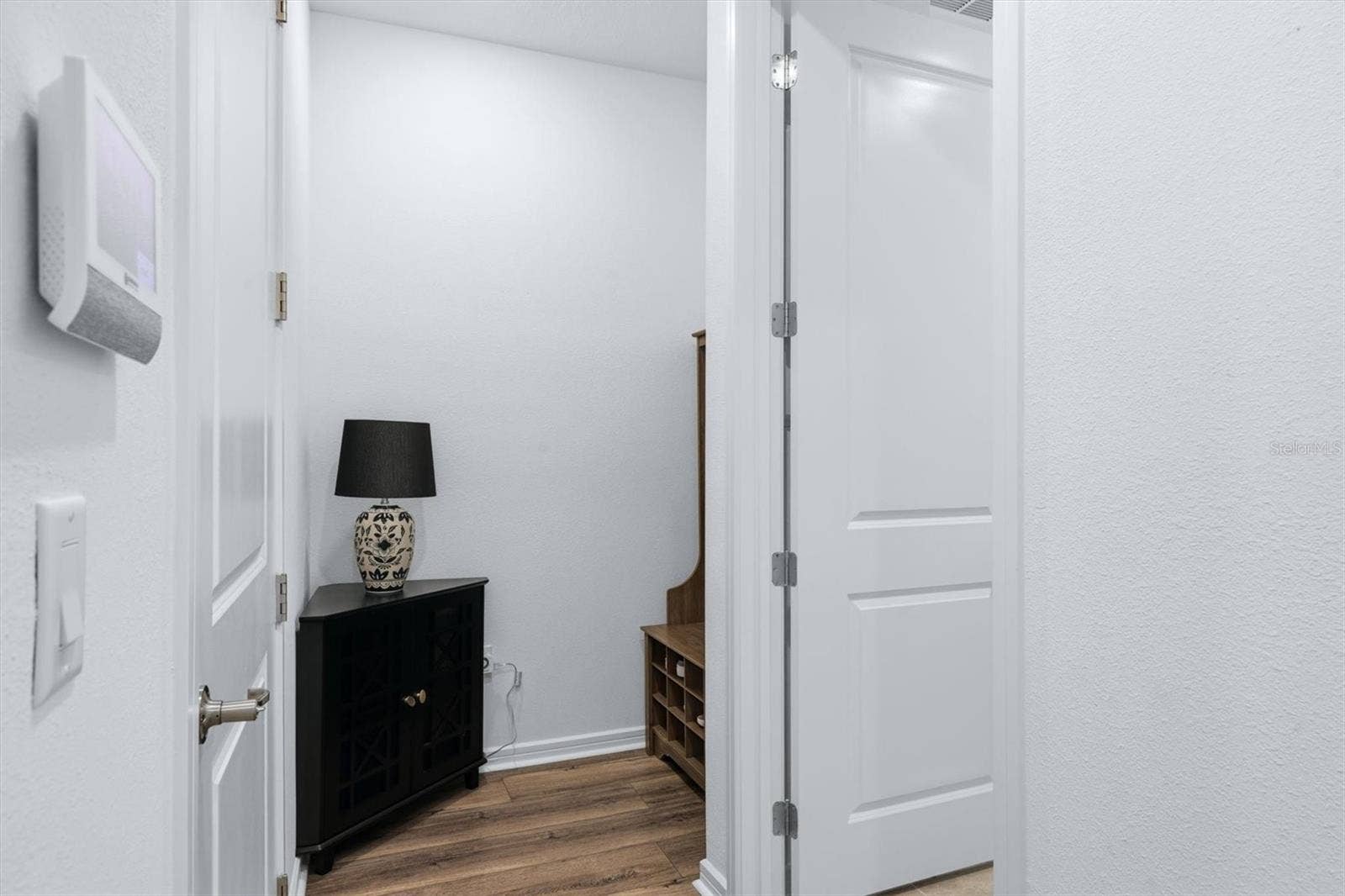 10635 WYNWARD WAY, Parrish, FL 34219 A mudroom area tucked away inside garage door entry